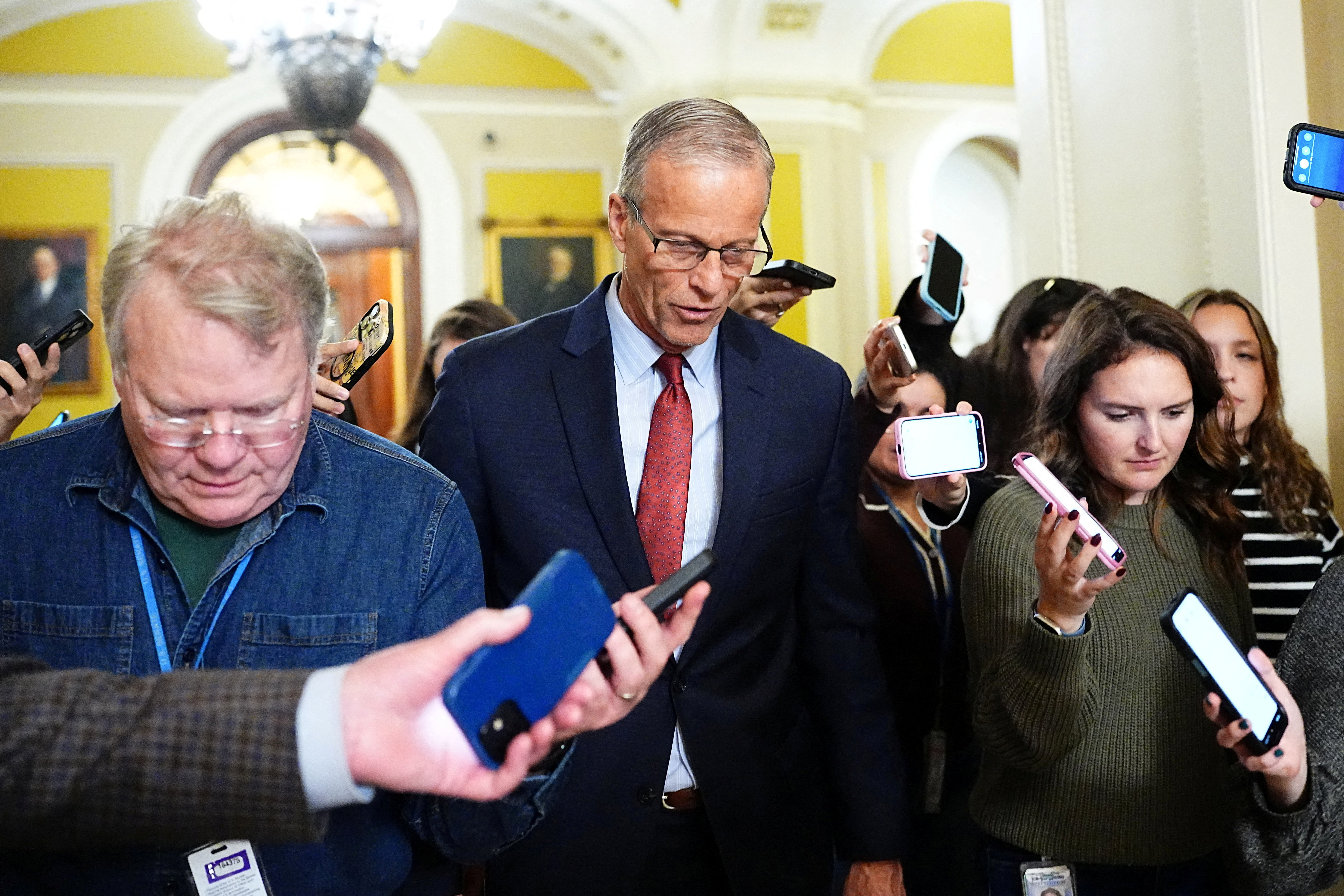 U.S. Senate Majority Leader John Thune (R-SD) speaks with reporters outside the Senate Chamber after the vote on the 40th day of the partial government shutdown, in Washington, D.C., U.S., November 9, 2025. REUTERS/Aaron Schwartz
