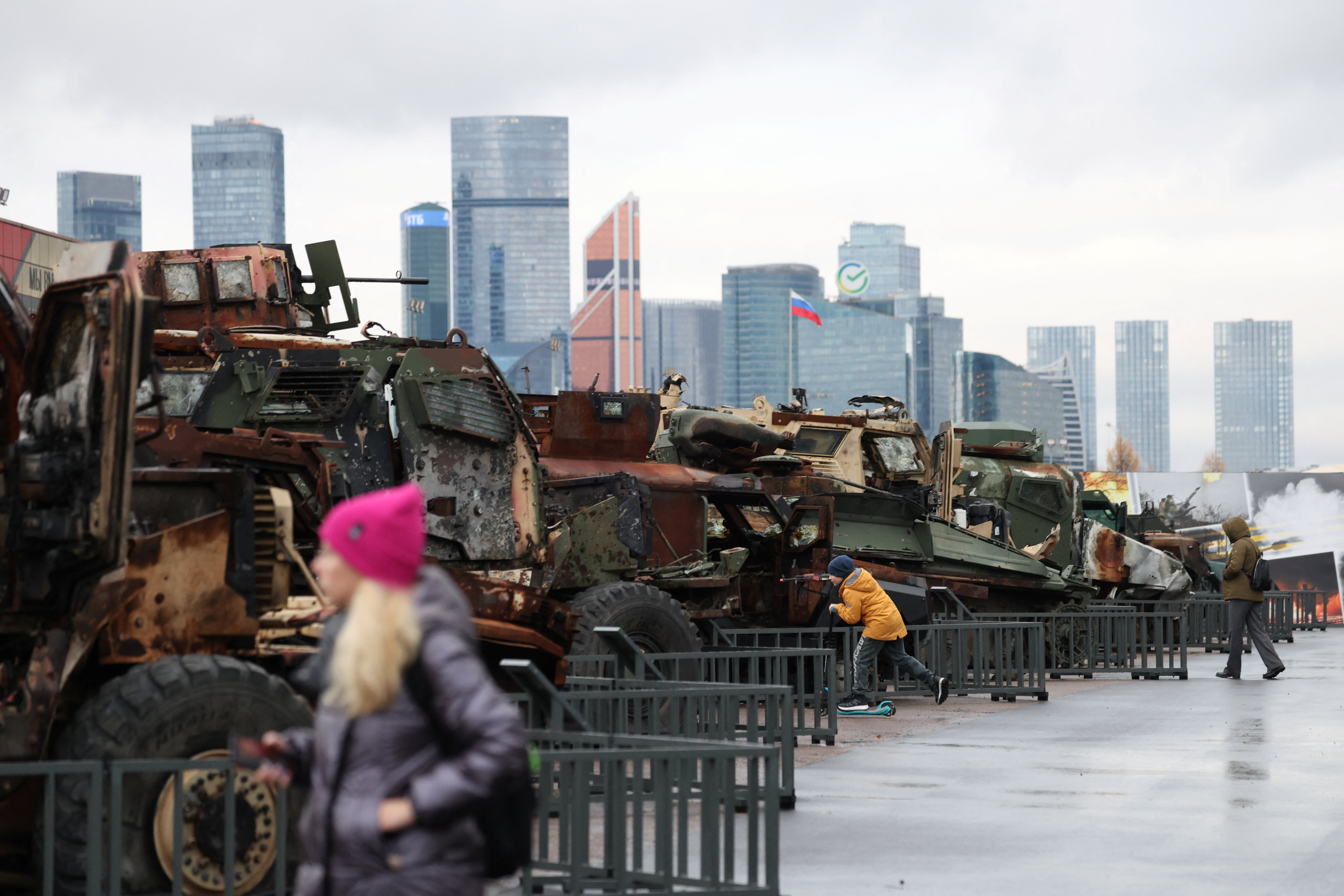 FILE PHOTO: People visit an exhibition of military hardware and equipment, said to have been destroyed and captured by Russian armed forces in the course of a conflict against Ukraine, at the Victory Museum, with the Moscow International Business Centre (Moskva-City) visible in the background in Moscow, Russia, November 4, 2025. REUTERS/Anastasia Barashkova/File Photo