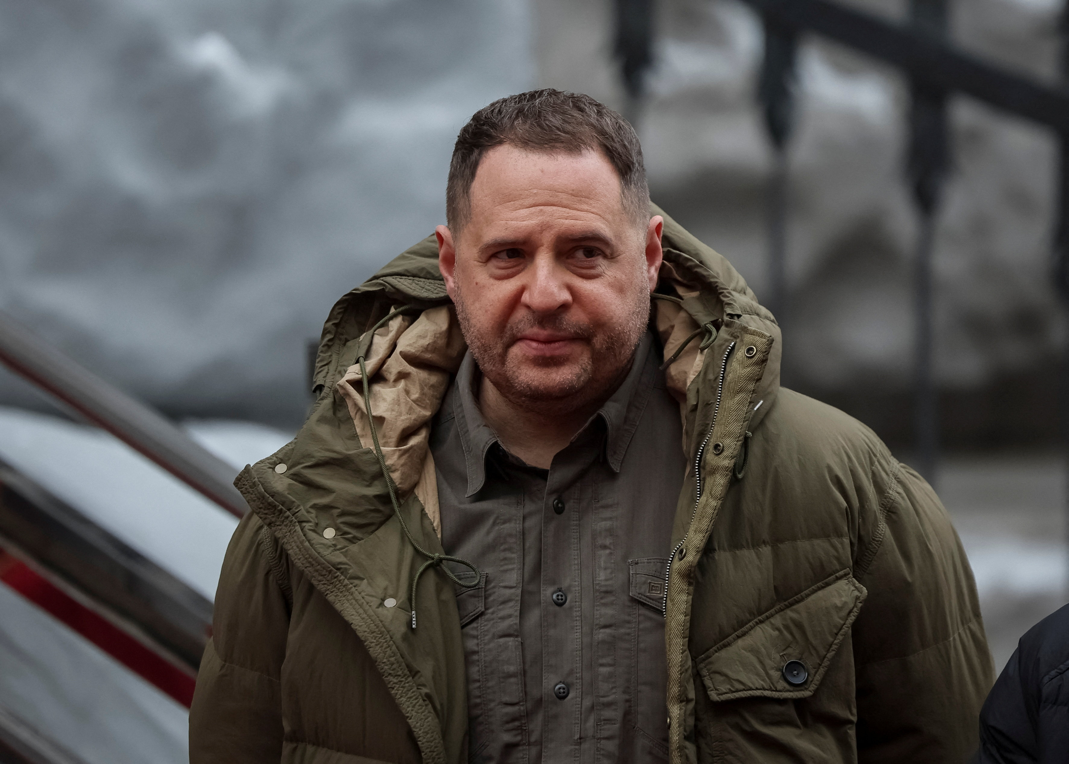 Andriy Yermak looks on.