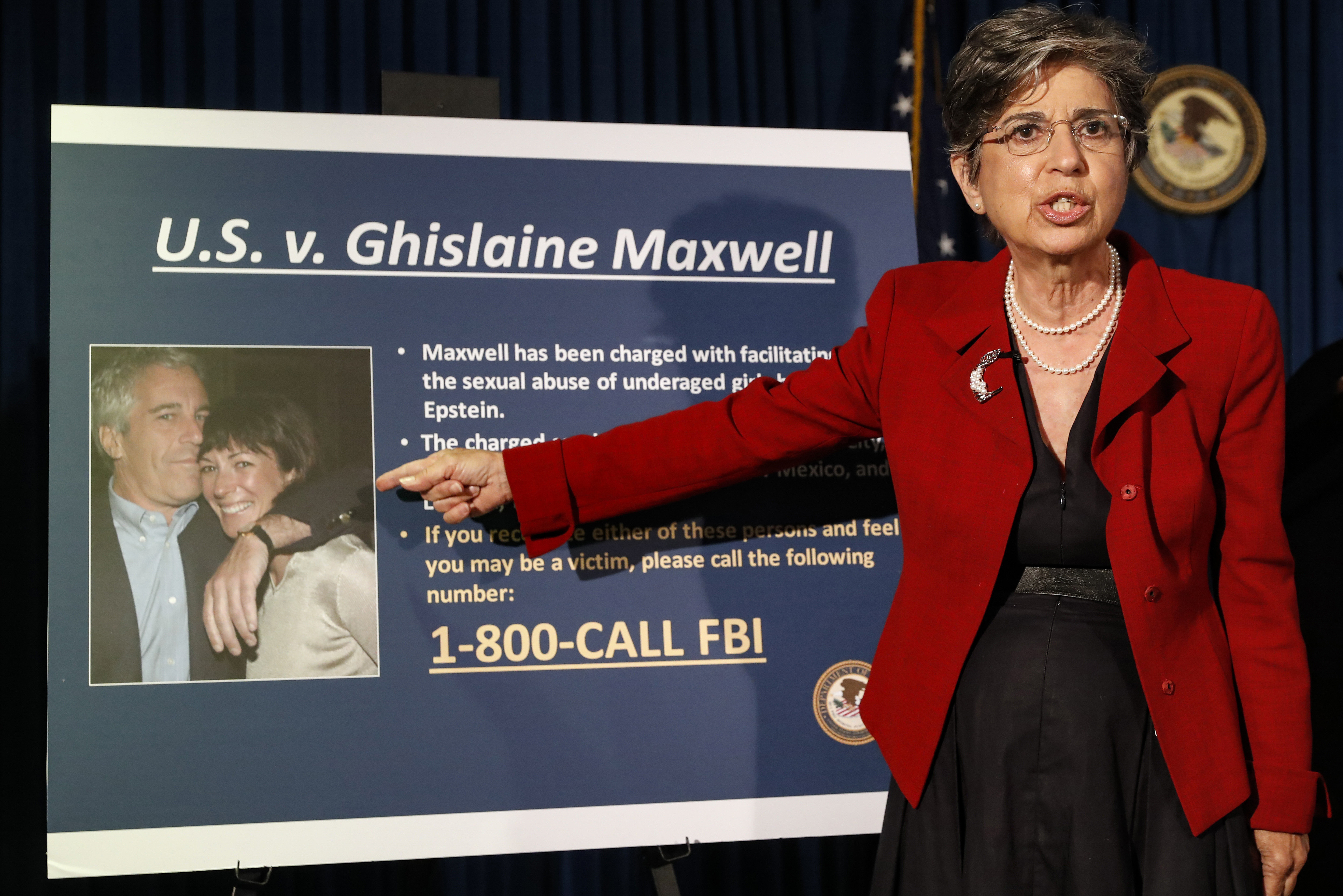 Audrey Strauss, Acting United States Attorney for the Southern District of New York, points to a photo of Jeffrey Epstein and his ex-girlfriend Ghislaine Maxwell. Sex trafficking charges were added Monday, March 29, 2021 to the indictment against financier Jeffrey Epstein’s ex-girlfriend as prosecutors alleged that she groomed a 14-year-old girl to recruit other young females in the early 2000s to provide “sexualized massages” to Epstein in return for cash. (AP Photo/John Minchillo, File)