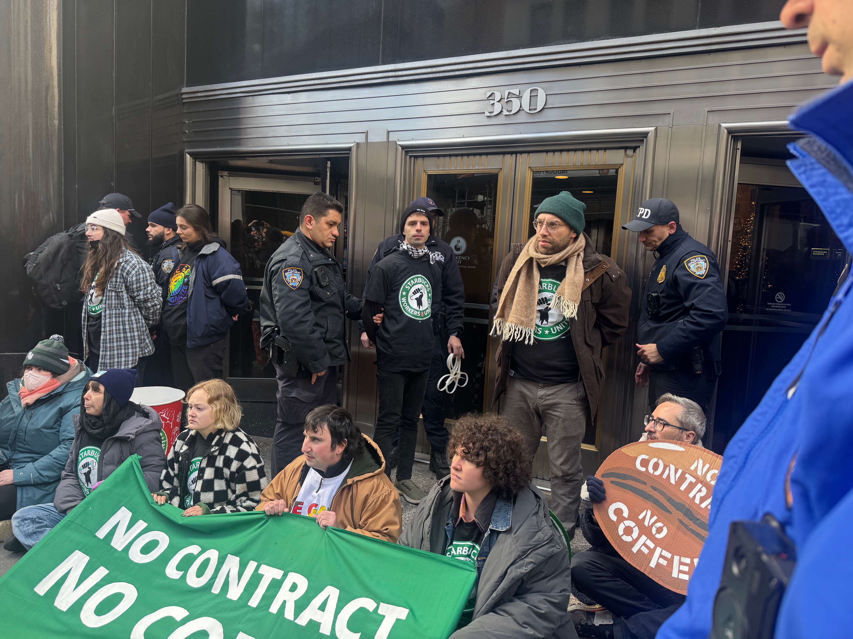 12 picketers were arrested at a demonstration on Thursday as they blocked the entrance the Empire State Building [Andy Hirschfeld/Al Jazeera]