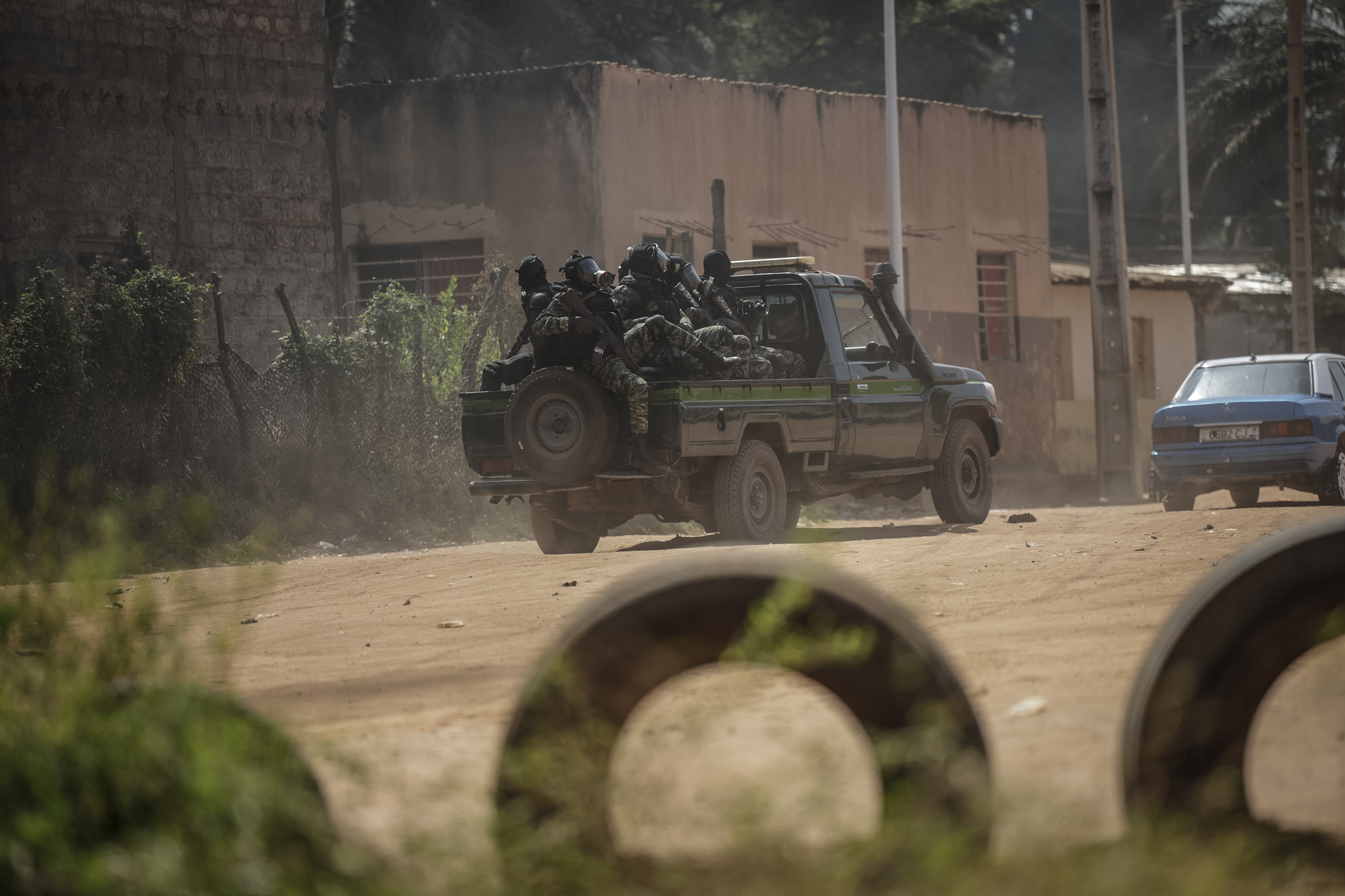 A Guinea Bissau security forces patrol car drive through the area of incidents with protestors in Bissau on Novmeber 29, 2025. (Photo by Patrick MEINHARDT / AFP)
