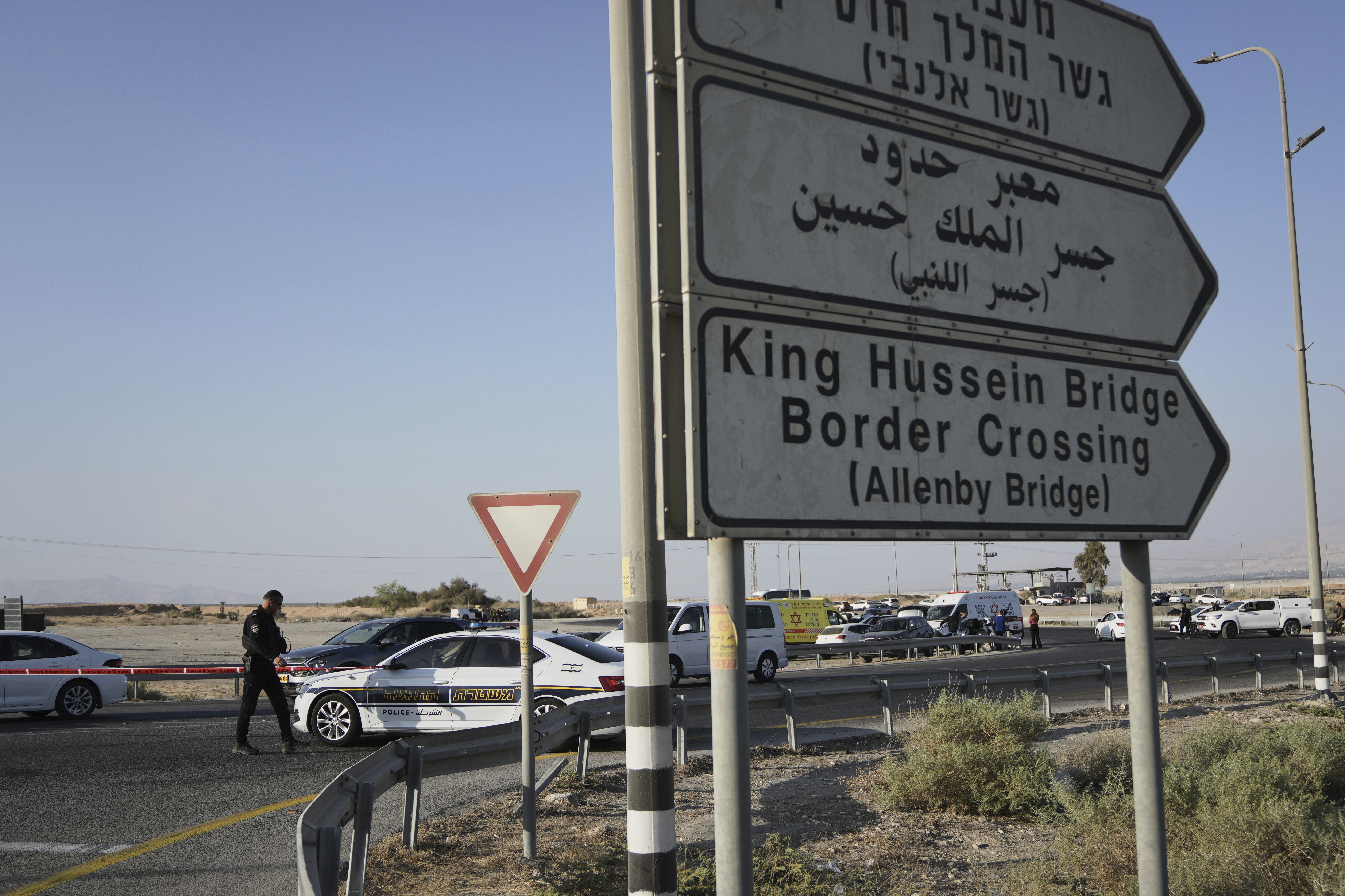 Israeli police stand guard near the site of a shooting attack where Israeli officials say two people were shot and killed in a militant attack at the Allenby Bridge Crossing between the West Bank and Jordan, Thursday, Sept. 18, 2025. (AP Photo/Mahmoud Illean)