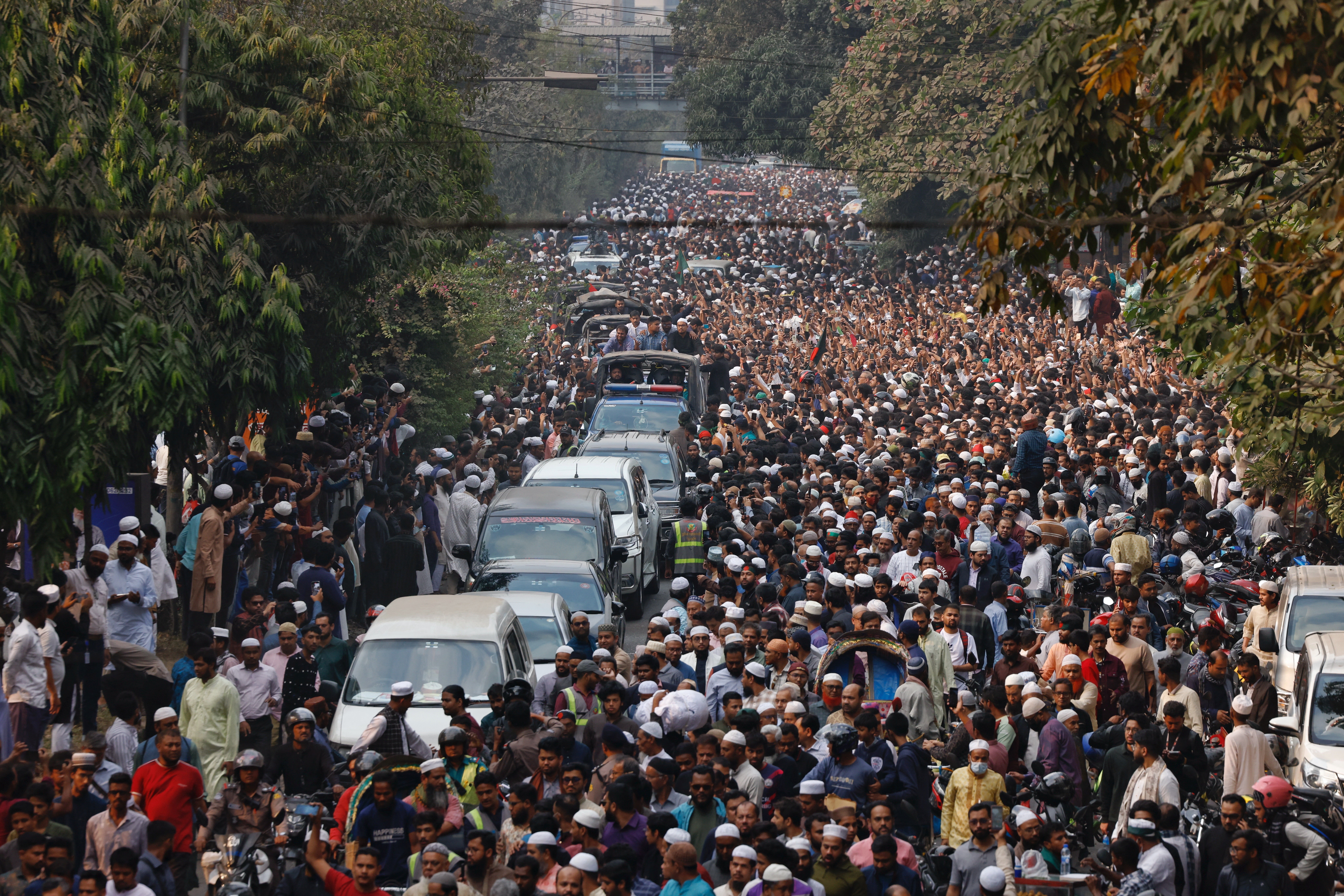 People mourn as they join the funeral prayer for Sharif Osman Hadi, a student leader, who died after being shot in the head, at the Parliament building area of Manik Mia Avenue, in Dhaka, Bangladesh, December 20, 2025. REUTERS/Mohammad Ponir Hossainz