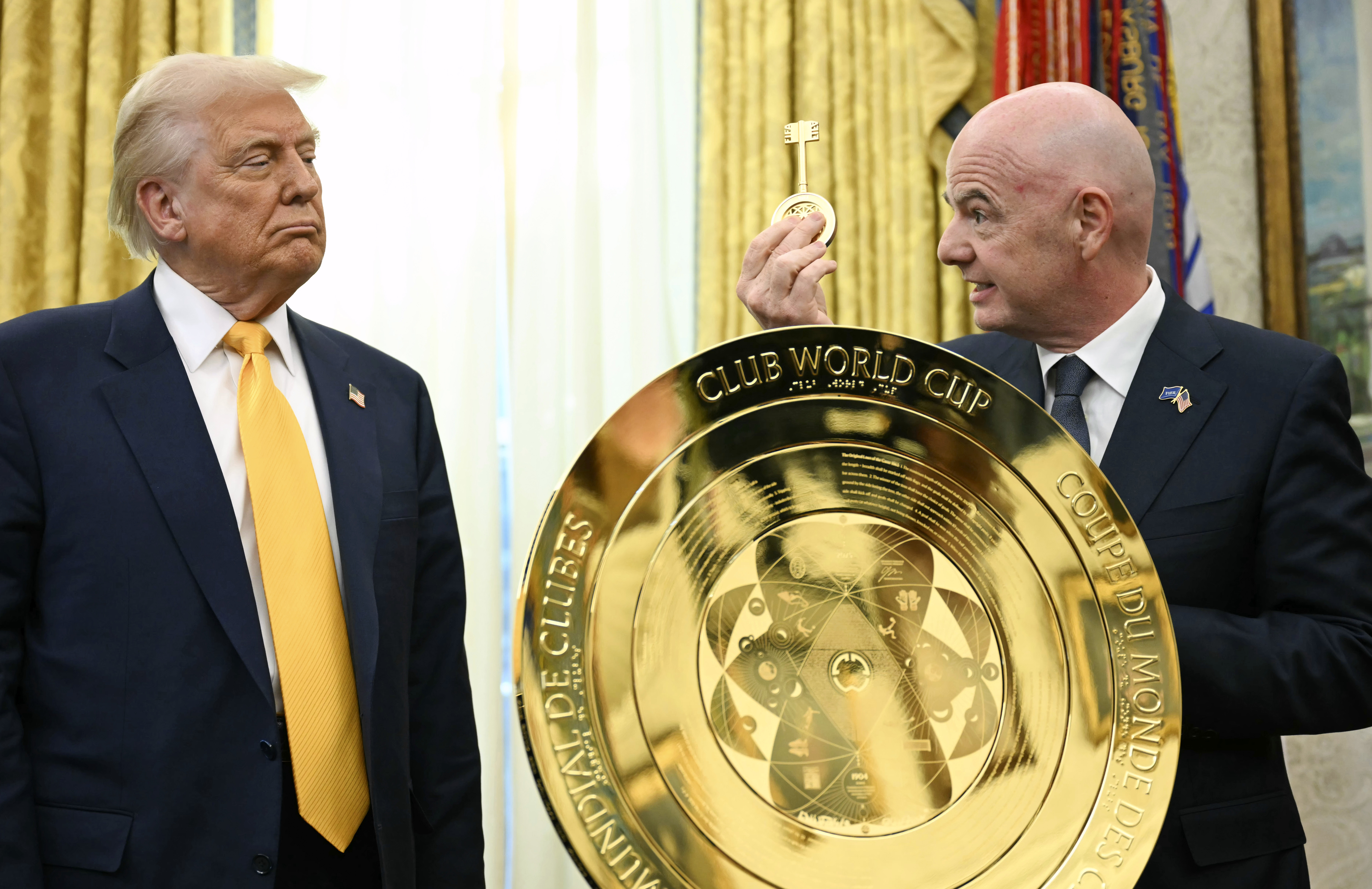 Gianni Infantino presents Trump with a key to the FIFA Club Cup trophy