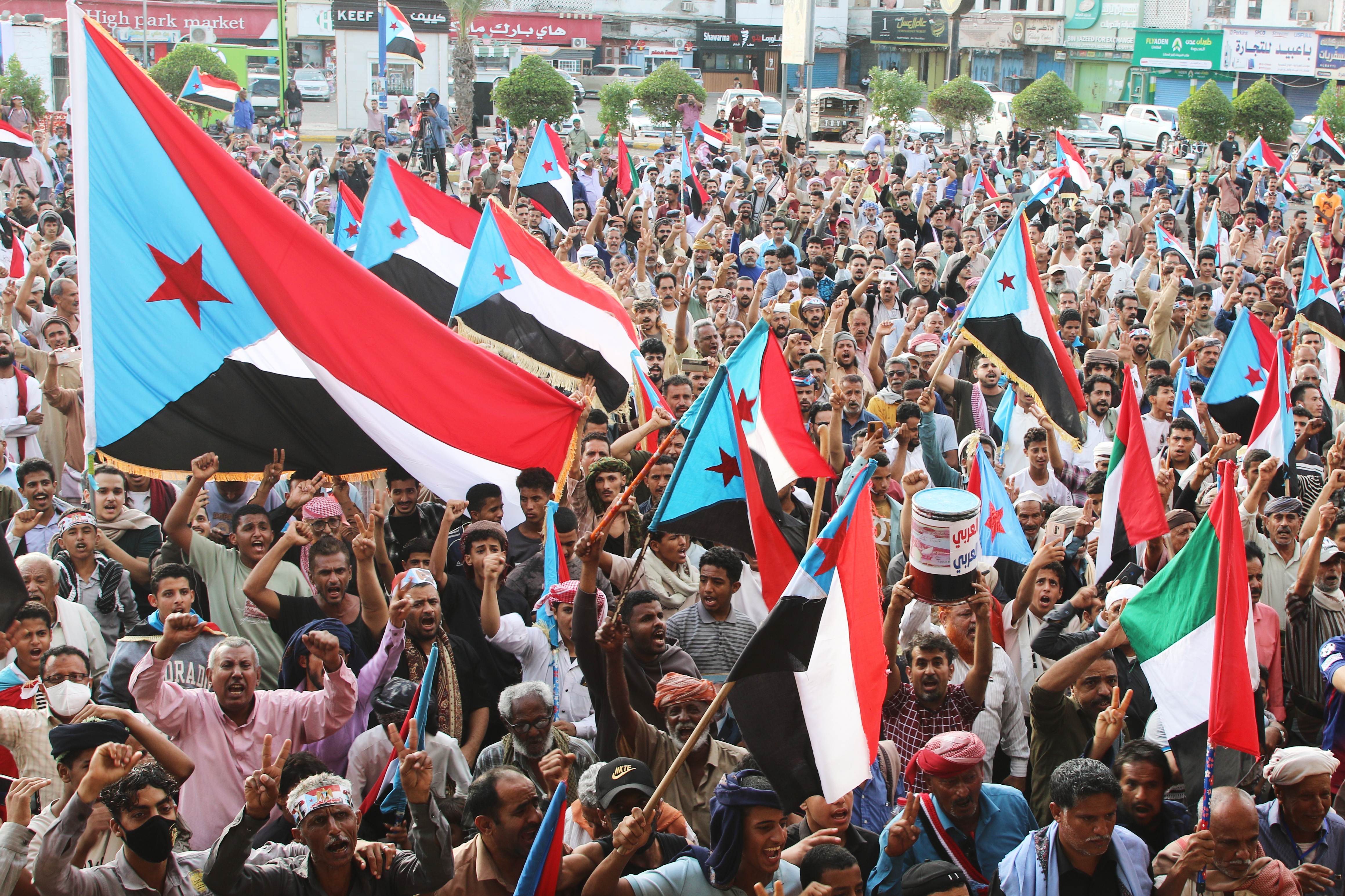 Supporters of the Southern Transitional Council (STC), a coalition of separatist groups seeking to restore the state of South Yemen, hold South Yemen flags during a rally, in Aden,
