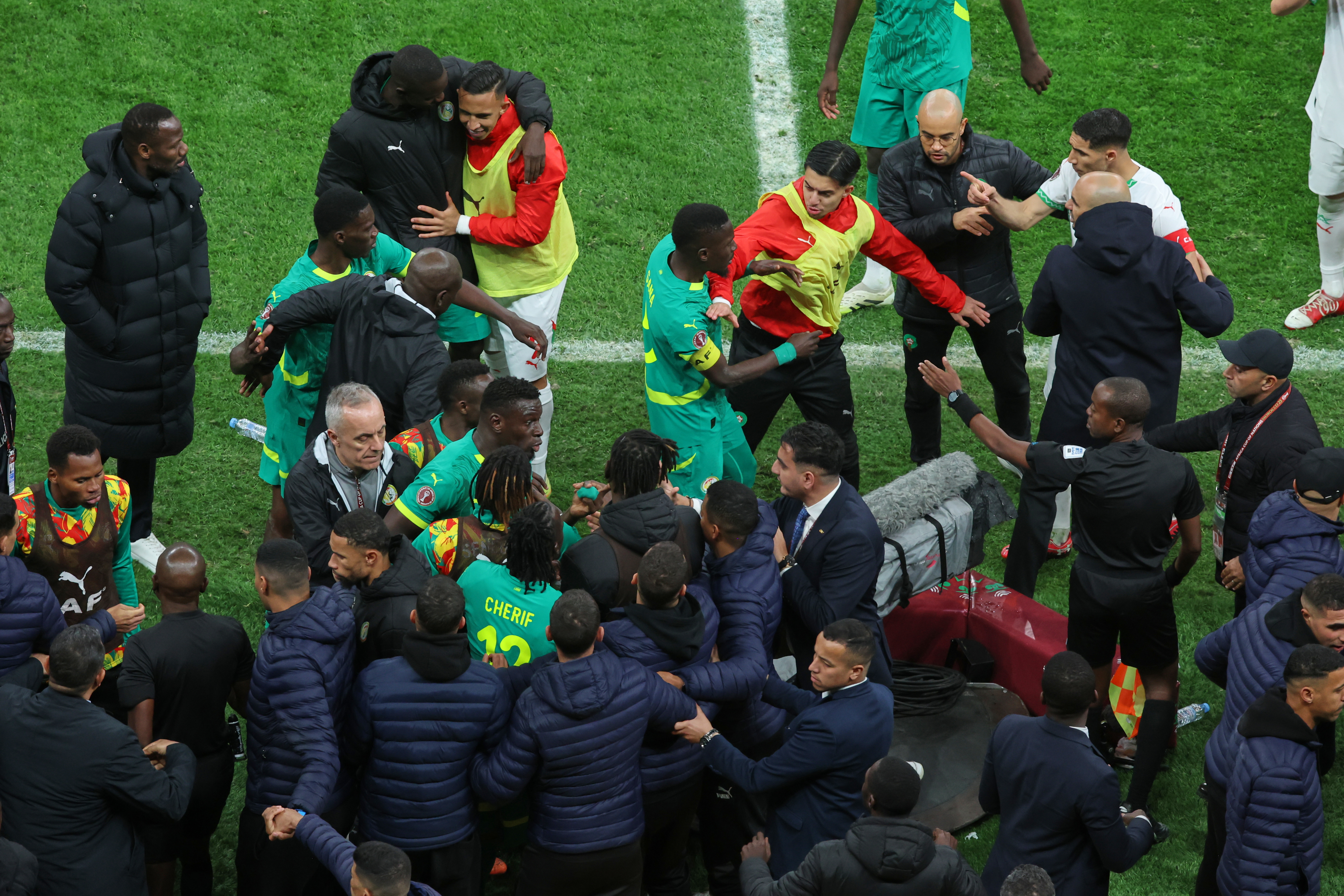 Players from both sides clash after a controversial penalty was awarded to Morocco late on during the Africa Cup of Nations final