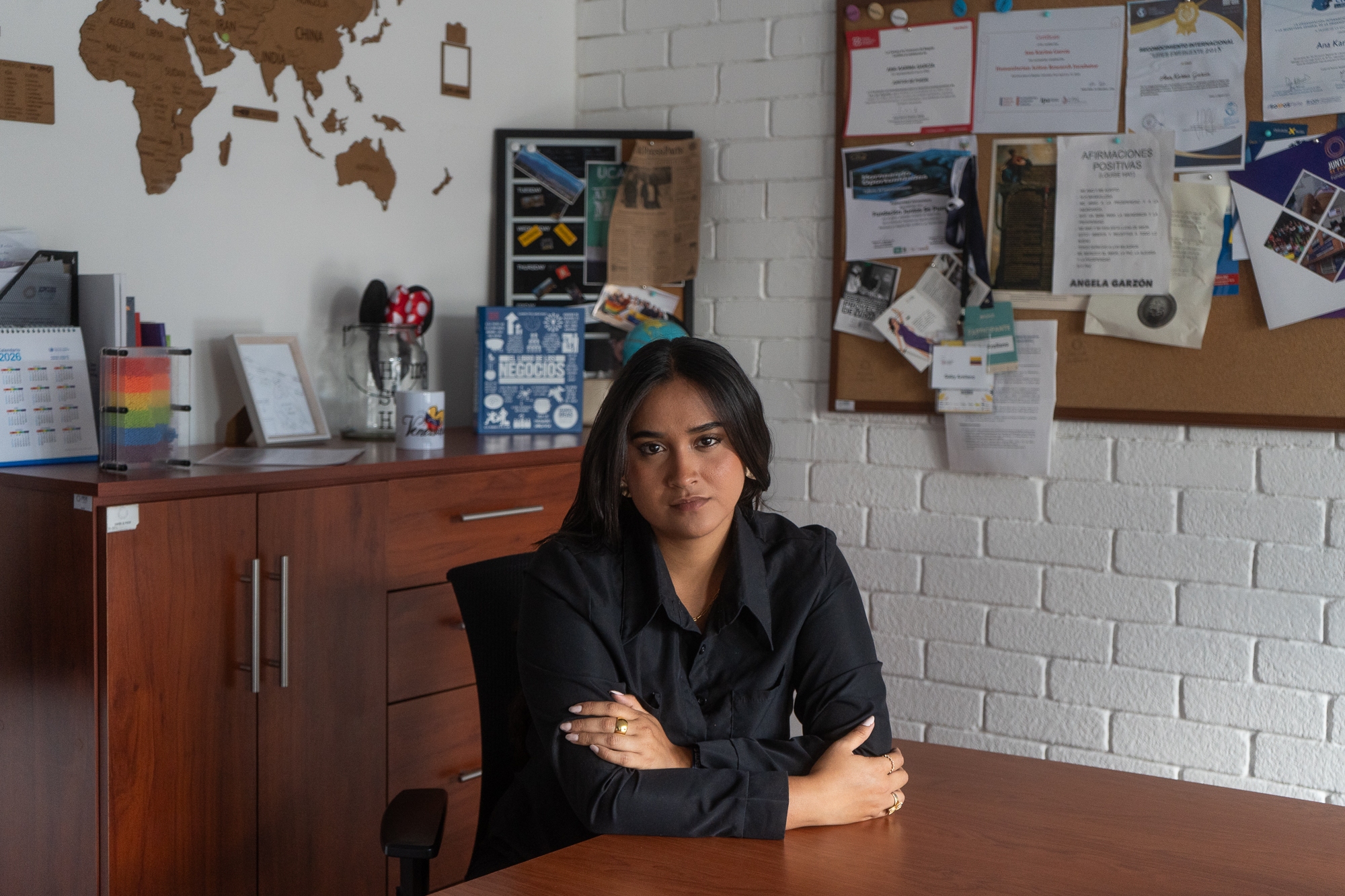 Angelica Angel sits at a table in Bogota, Colombia