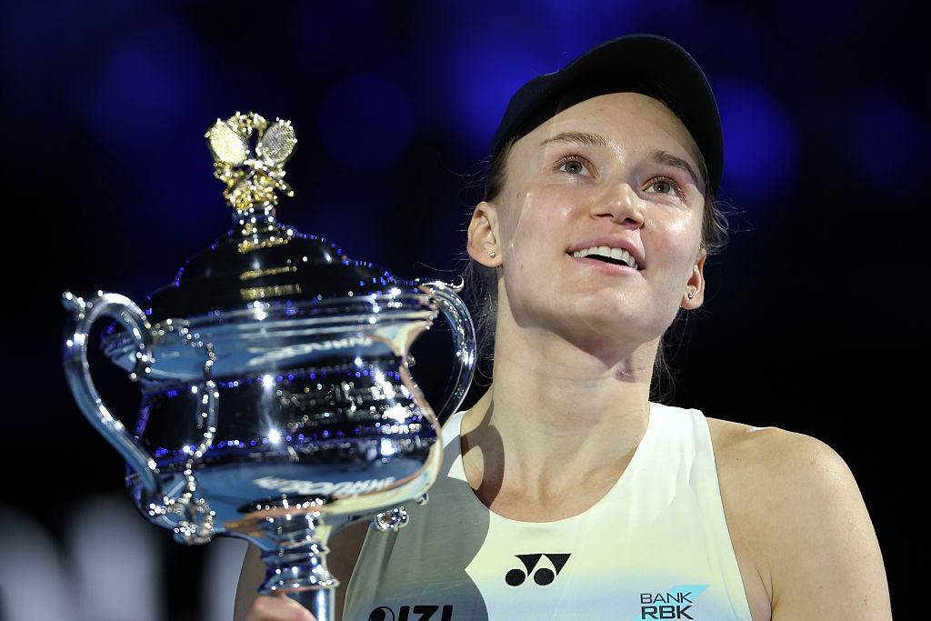 Elena Rybakina of Kazakhstan poses with the Daphne Akhurst Memorial Cup after her victory in the Women's Singles Final against Aryna Sabalenka at the Australia Open