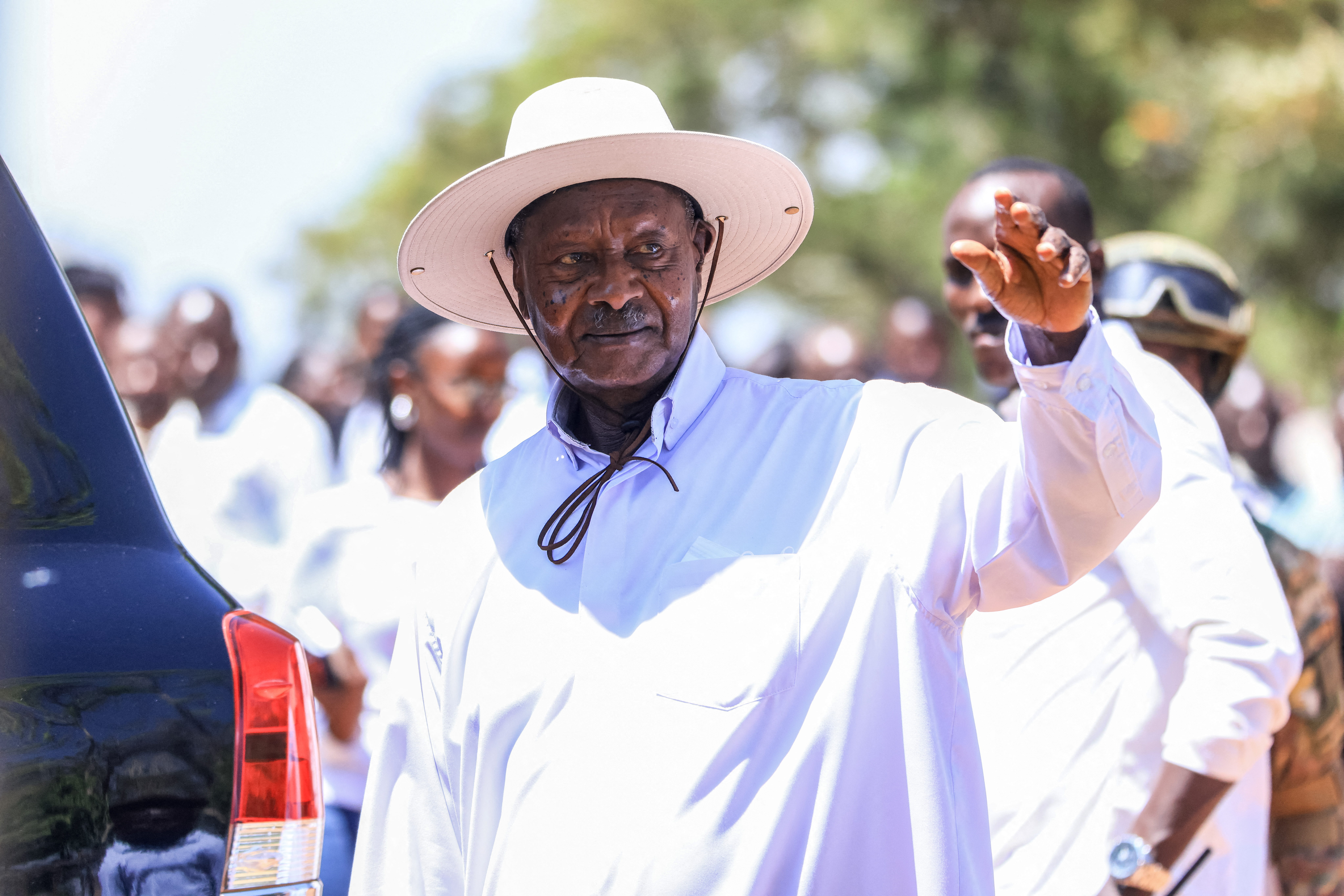 Uganda’s incumbent president and National Resistance Movement (NRM) presidential candidate Yoweri Museveni waves at supporters as he leaves after casting his ballot in Rwakitura on January 15, 2026 during Uganda’s 2026 general elections. (Photo by AFP)