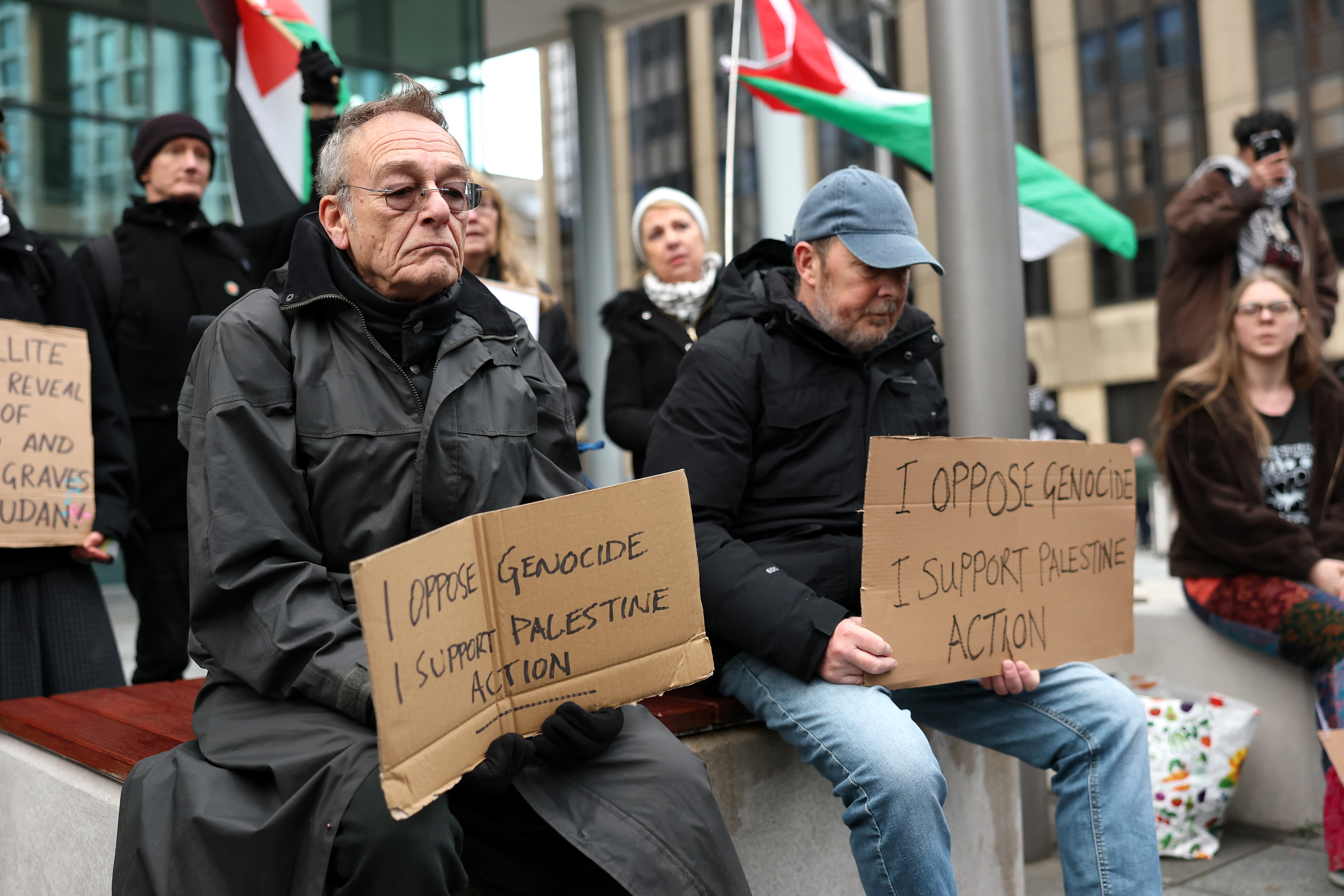 CARDIFF, WALES - NOVEMBER 29: Protesters hold signs reading "I oppose Genocide, I support Palestine Action" outside the stadium prior to the Quilter Nations Series 2025 rugby international match between Wales and South Africa at Principality Stadium on November 29, 2025 in Cardiff, Wales. (Photo by Dan Mullan/Getty Images)