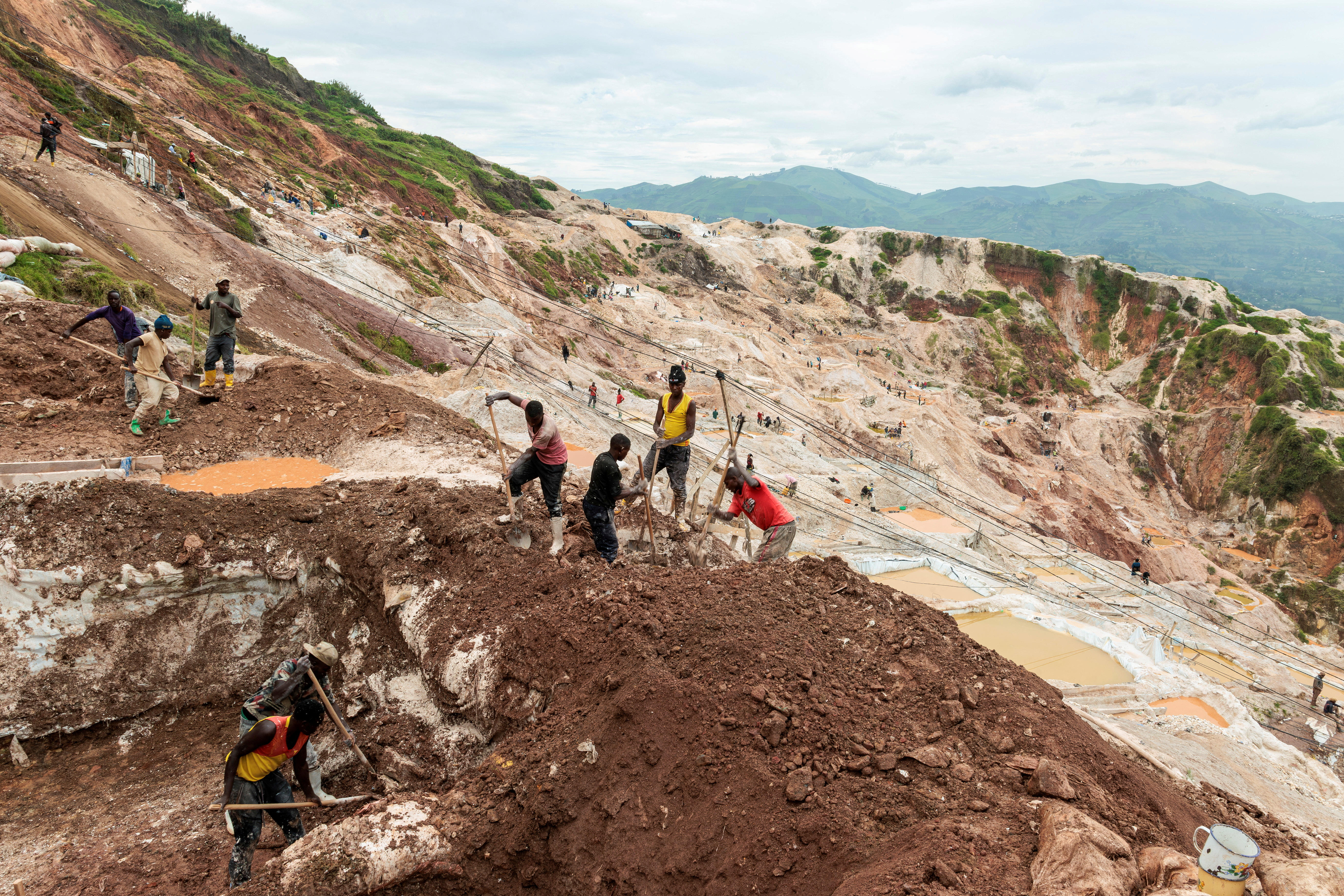 FILE PHOTO: Laborers dig at the Rubaya coltan mine, in the town of Rubaya, which is controlled by M23 rebels, in the eastern Democratic Republic of Congo March 24, 2025. REUTERS/Zohra Bensemra/File Photo