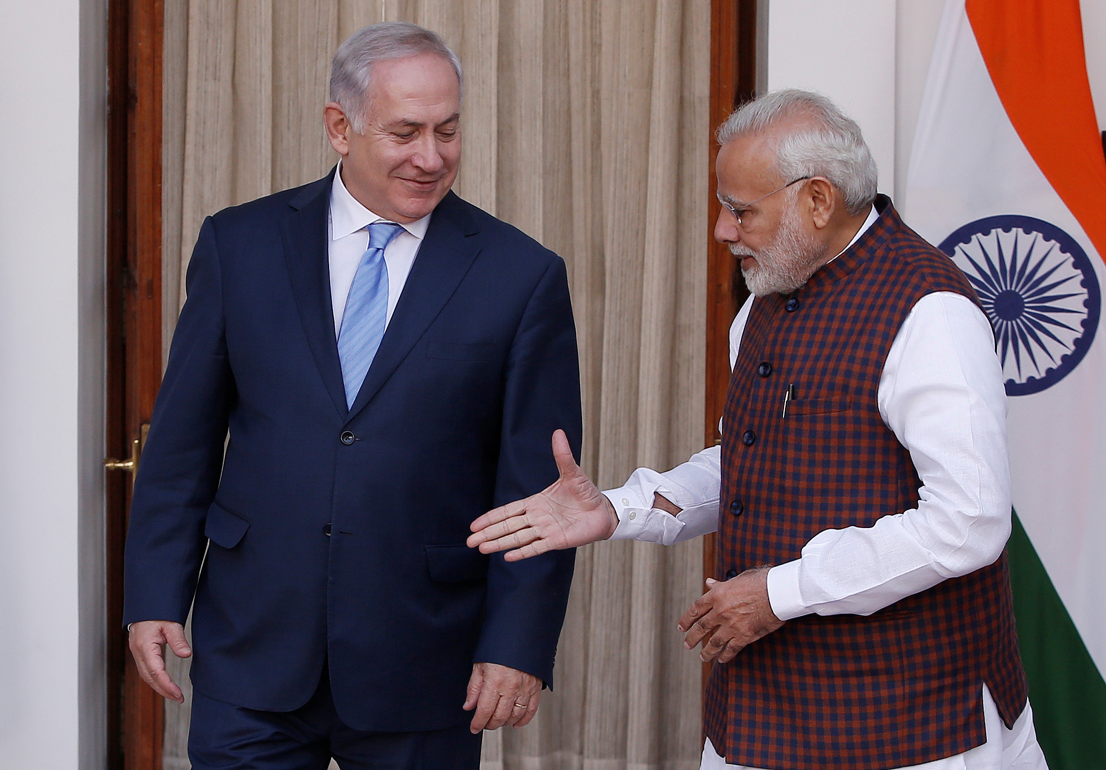 India's Prime Minister Narendra Modi extends his hand for a handshake with his Israeli counterpart Benjamin Netanyahu during a photo opportunity ahead of their meeting at Hyderabad House in New Delhi, India, January 15, 2018. REUTERS/Adnan Abidi