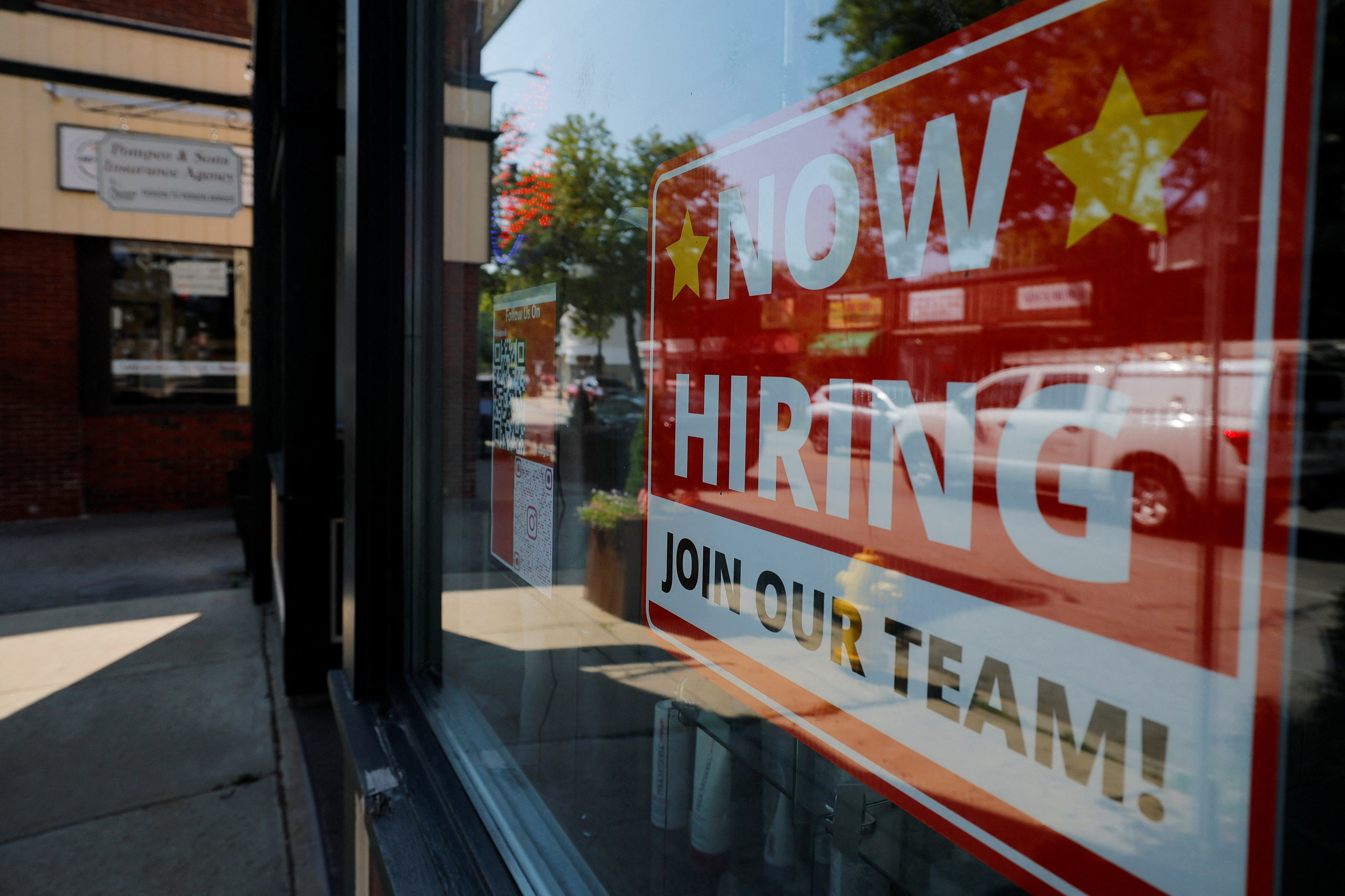 As layoffs surge job openings stall labour turnover stalls Americans who aren't making enough to meet their cost of living struggle to find new or additional work [File: Brian Snyder/Reuters]