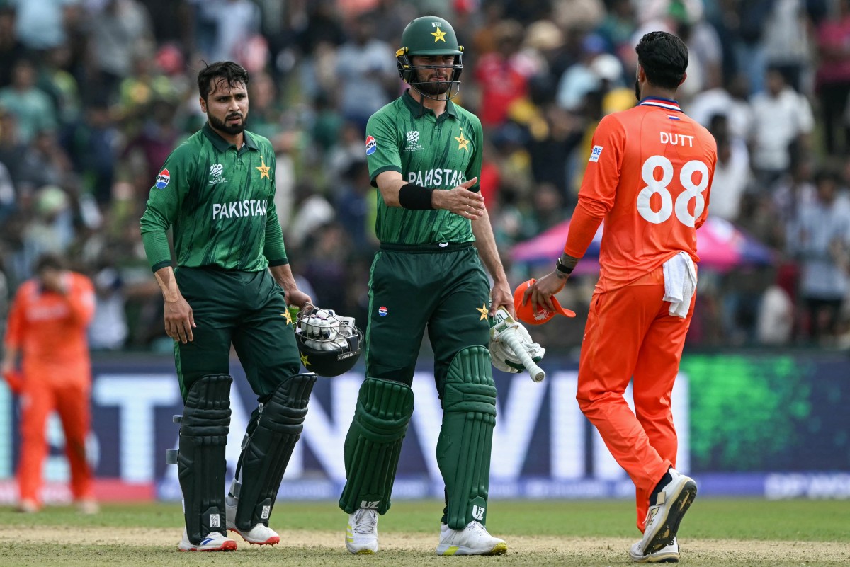 Pakistan's Shaheen Shah Afridi (C) and Faheem Ashraf (L) are congratulated by Netherlands' Aryan Dutt for their team's win at the end of the 2026 ICC Men's T20 Cricket World Cup group stage match