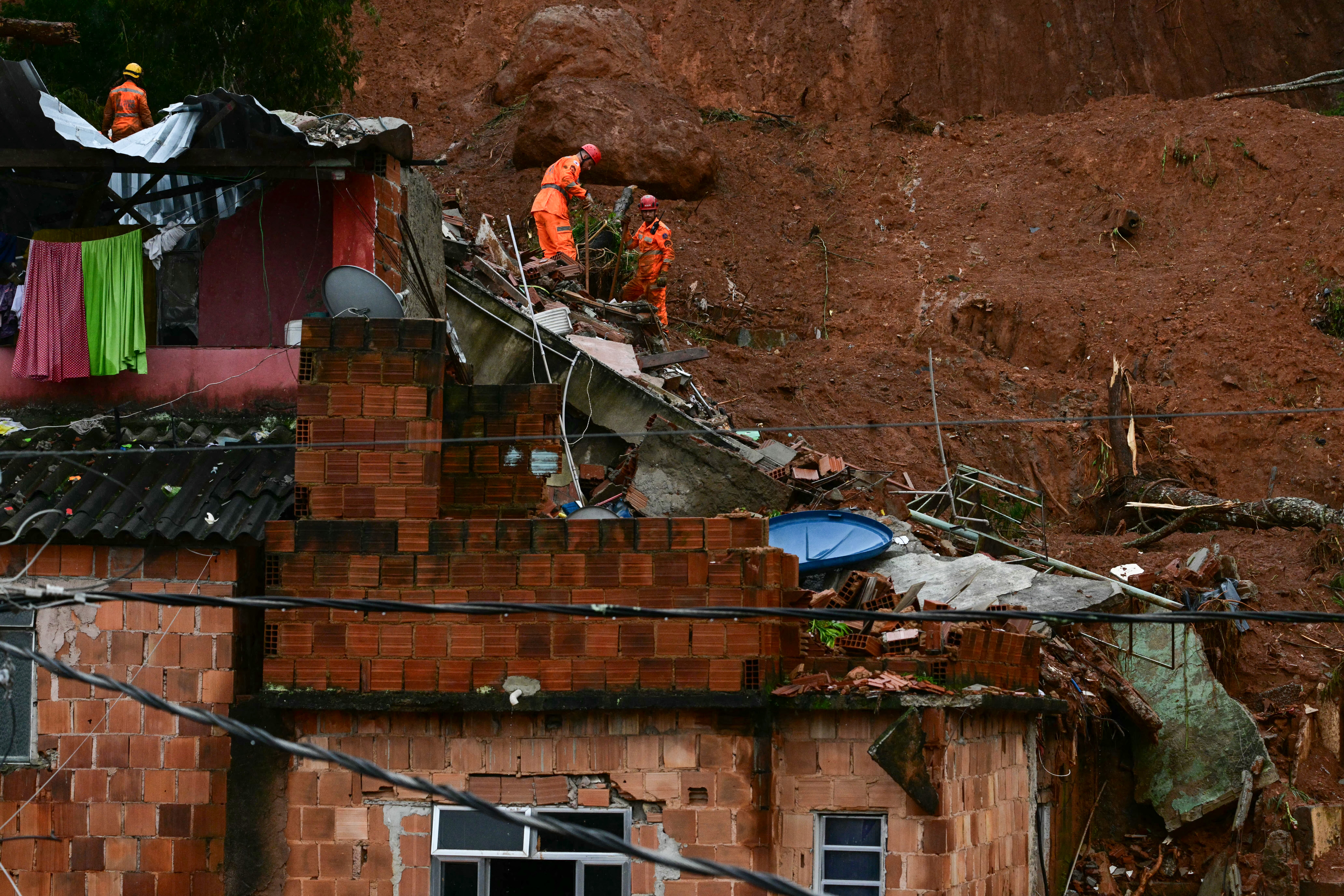 Rescuers search for missing after deluge kills 30 in Brazil