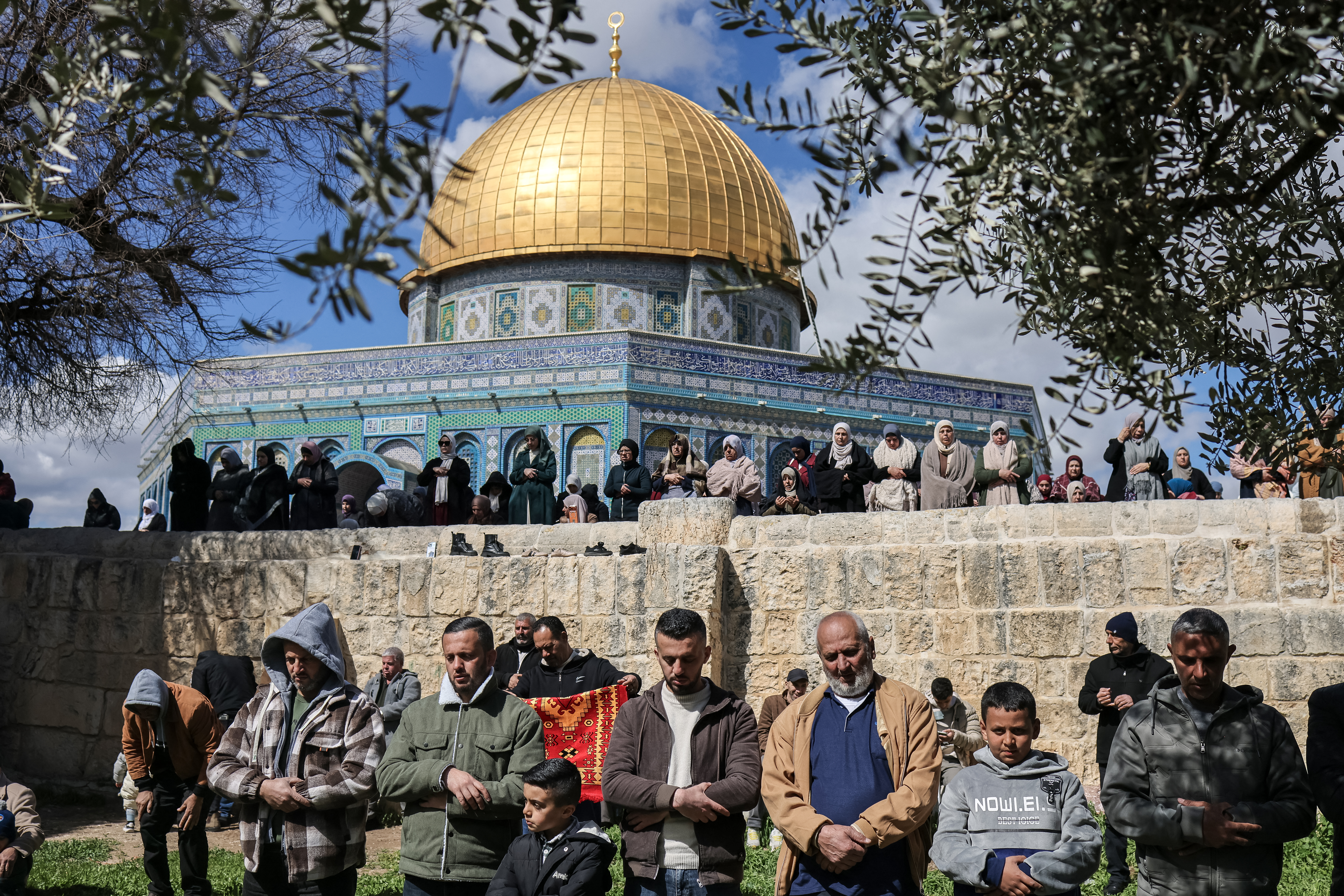 Muslim devotees offer Friday noon prayers at the Al-Aqsa compound in the Old City of Jerusalem on February 27, 2026, during the holy fasting month of Ramadan.