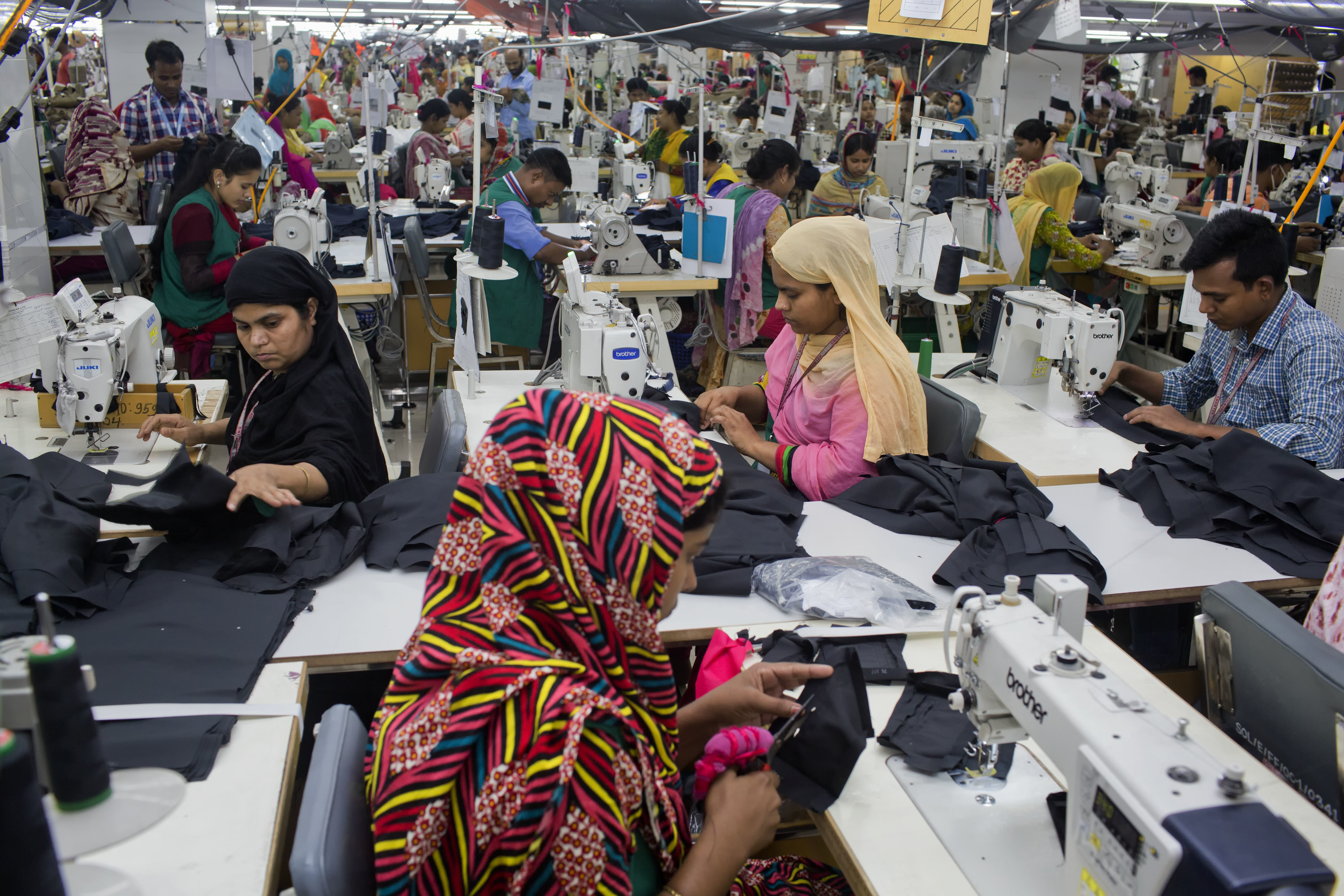Bangladeshis work at Snowtex garment factory in Dhamrai, near Dhaka, Bangladesh