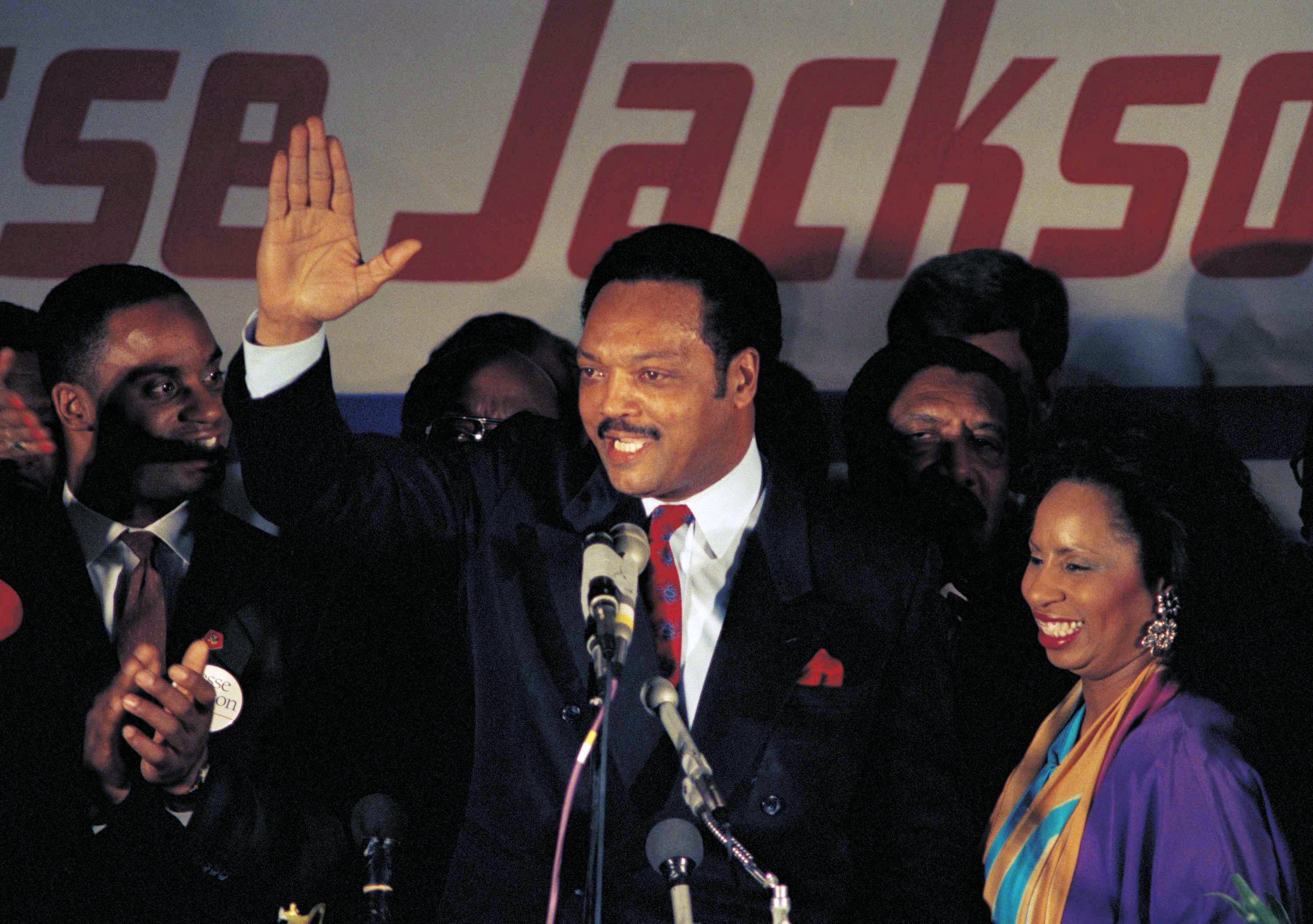 Jesse Jackson waves during his 1988 concession speech