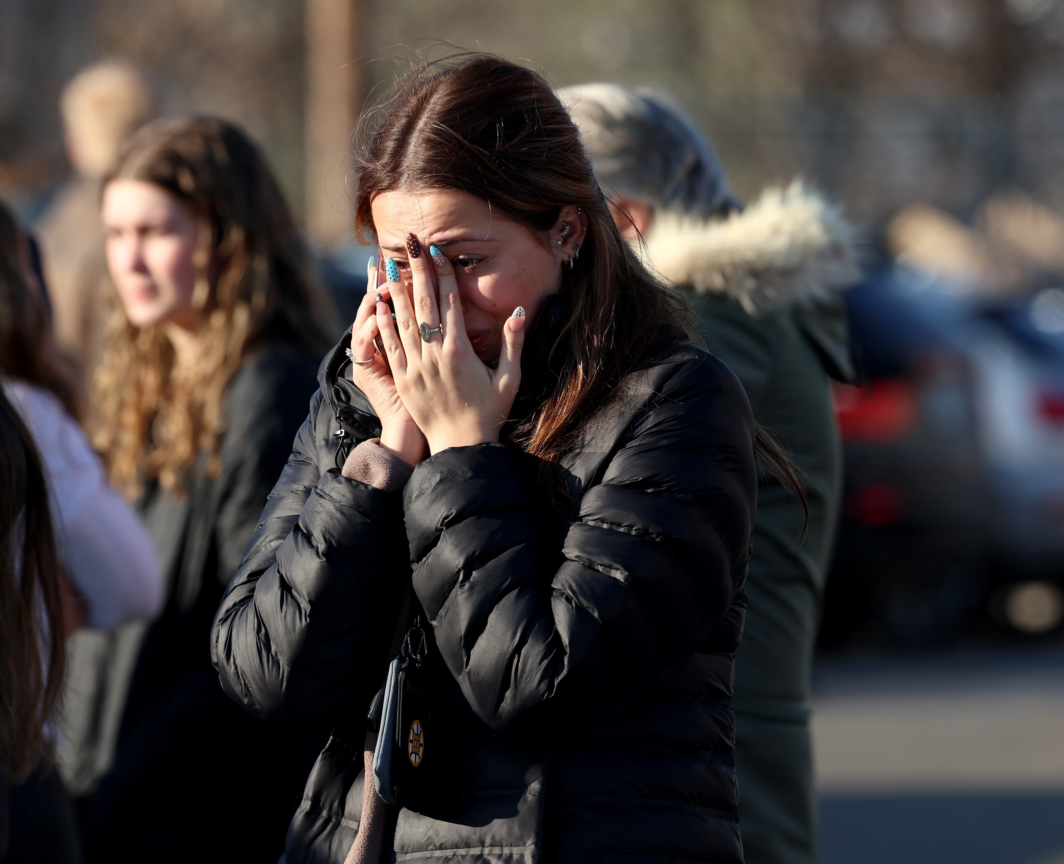 A woman mourns after a shooting in Rhode Island