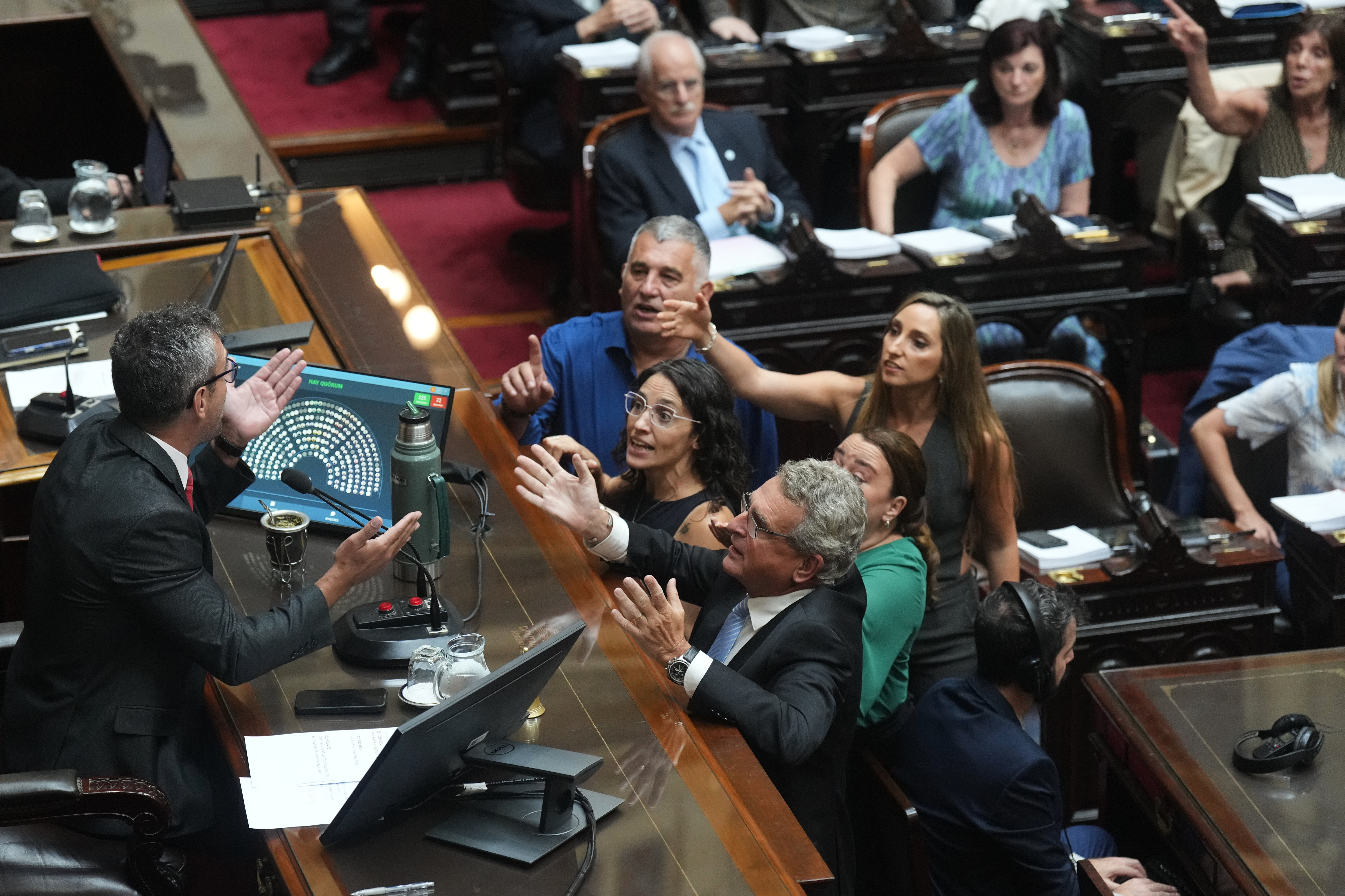 Opposition lawmakers argue with Chamber of Deputies President Martin Menem during debate on a labor reform bill proposed by President Javier Milei's government in Buenos Aires, Argentina