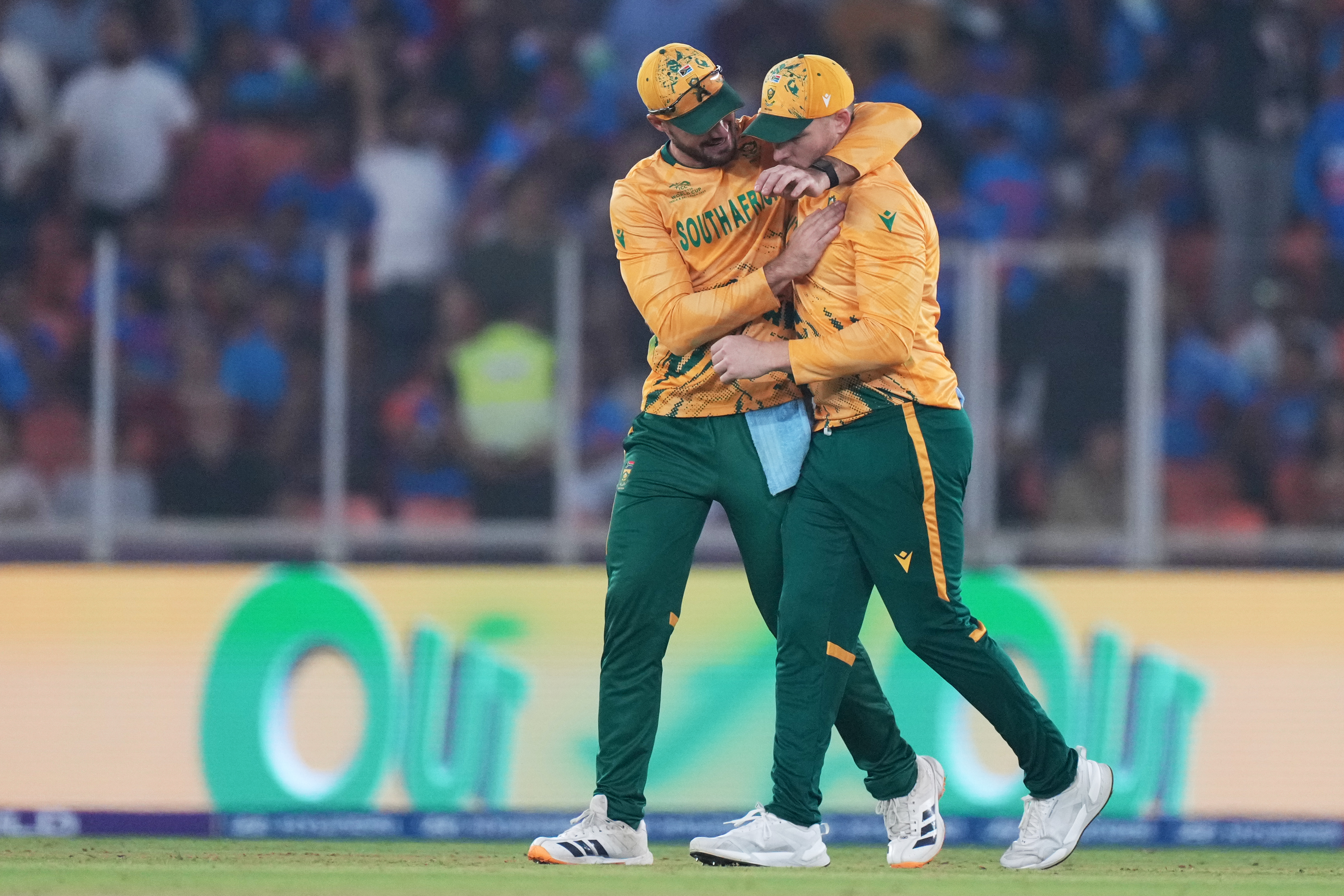 South Africa's captain Aiden Markram, left, and teammate David Miller celebrate after winning their T20 World Cup cricket match against India in Ahmedabad, India, Sunday, Feb. 22, 2026. (AP Photo/Ajit Solanki)