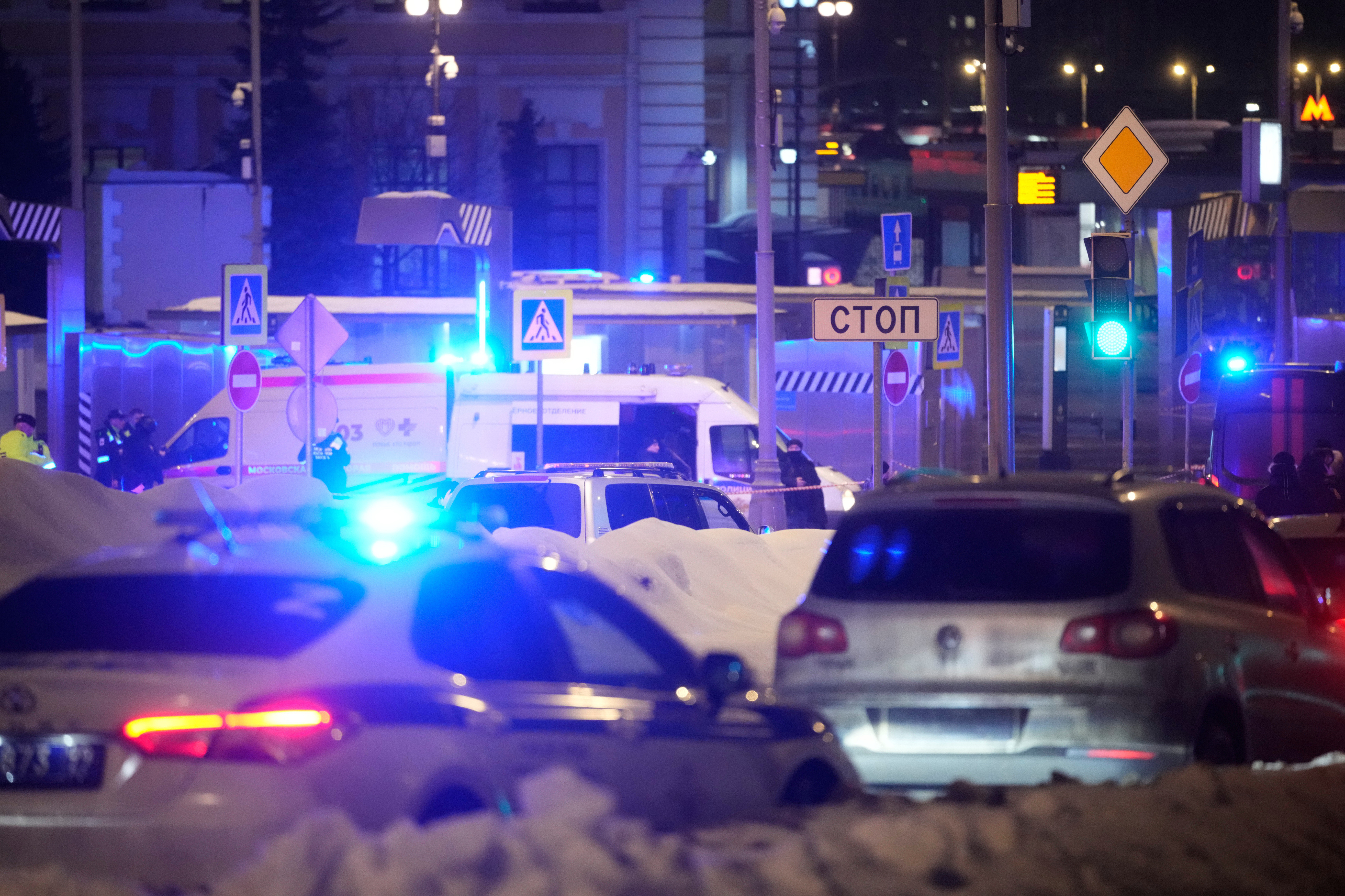 Police and emergency services are seen at the scene of an attack on a police patrol near the Savyolovsky Railway Station, in Moscow, Tuesday, Feb. 24, 2026. (AP Photo)