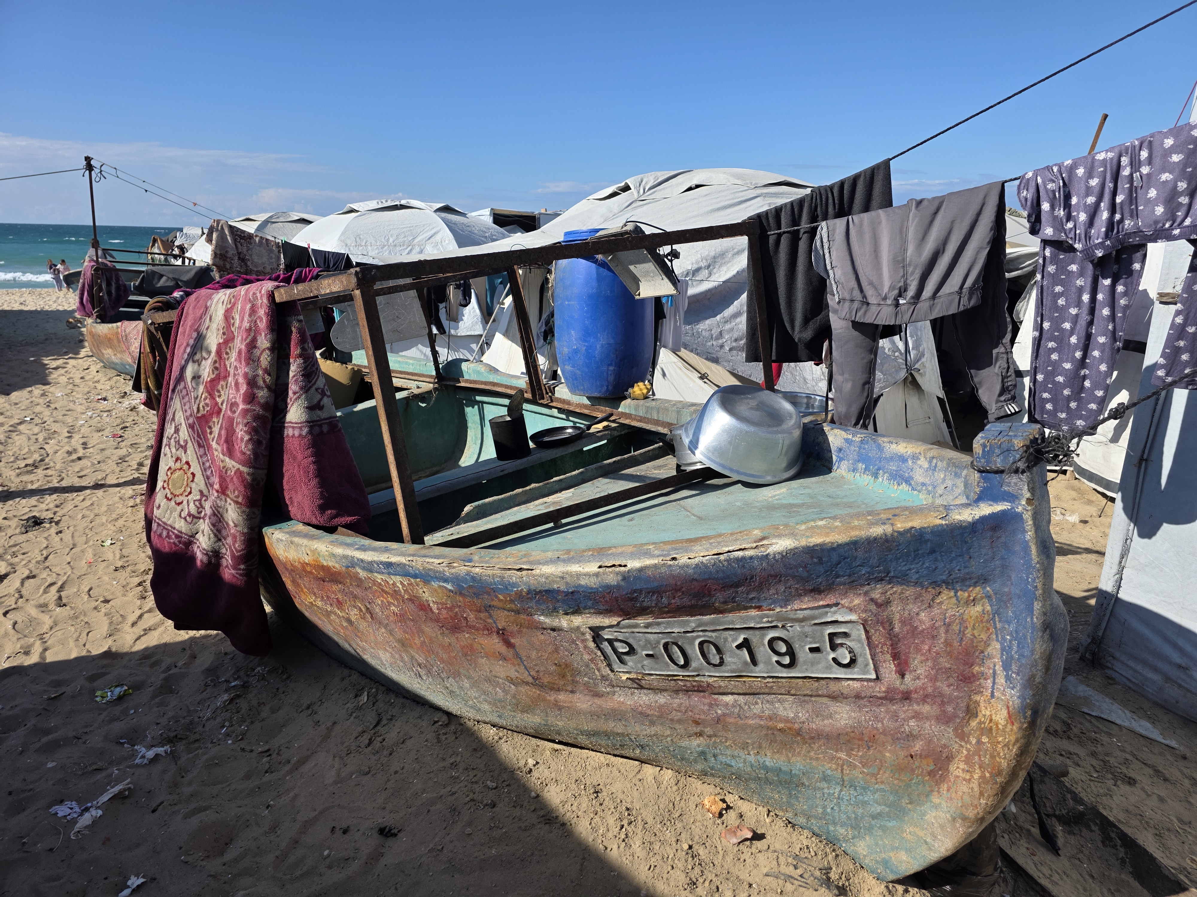 Fishing boats destroyed by the Israeli forces, now used as tents supporters.