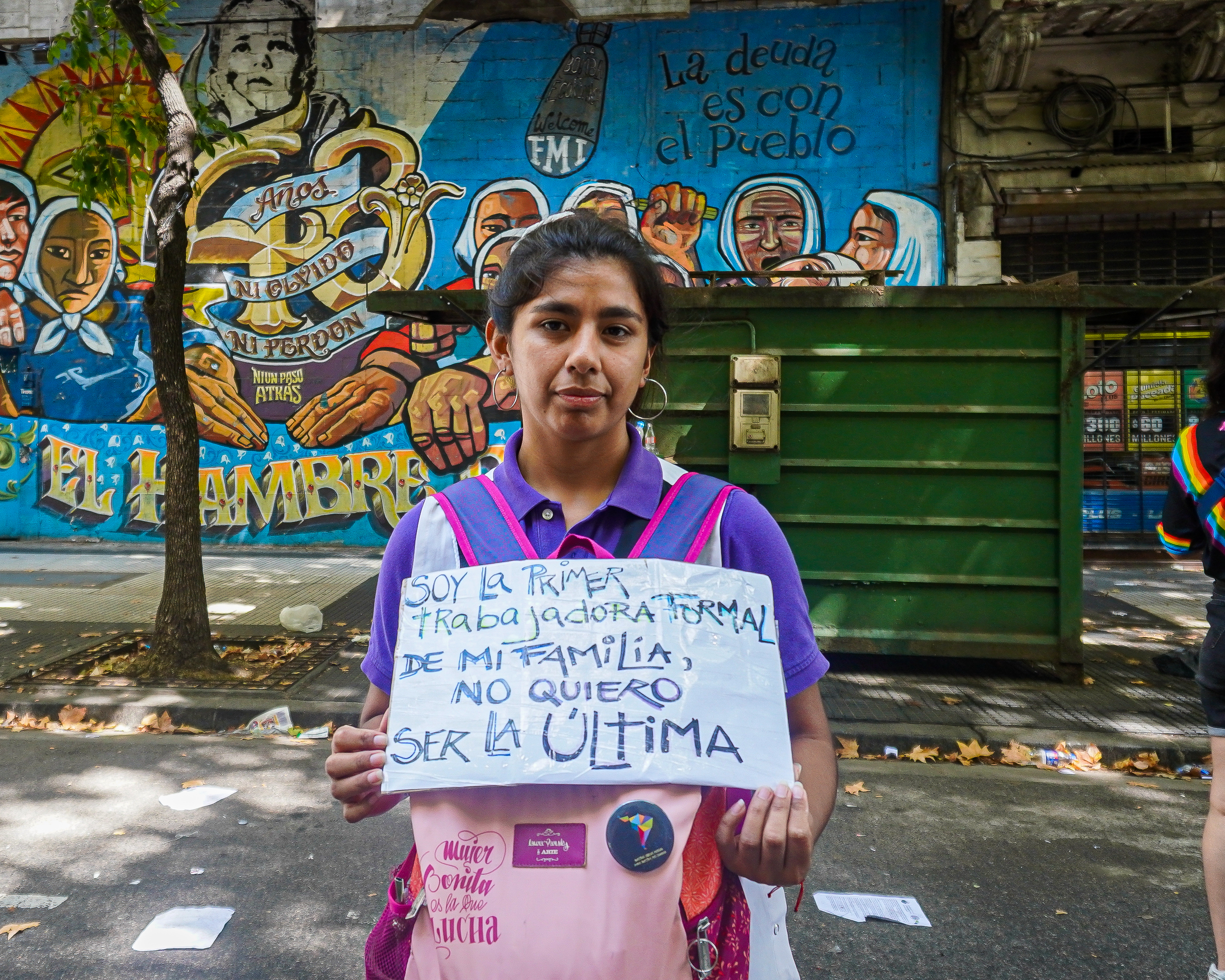 Gabriela Quiroz holds a sign protesting Argentina's labour reform