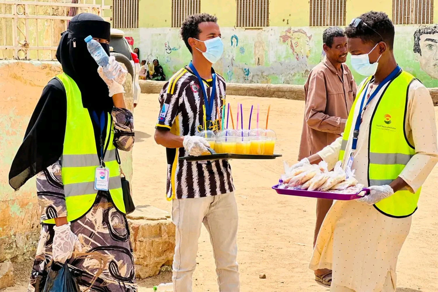 Volunteers from the Min Ajl Kosti initiative assist in a temporary shelter
