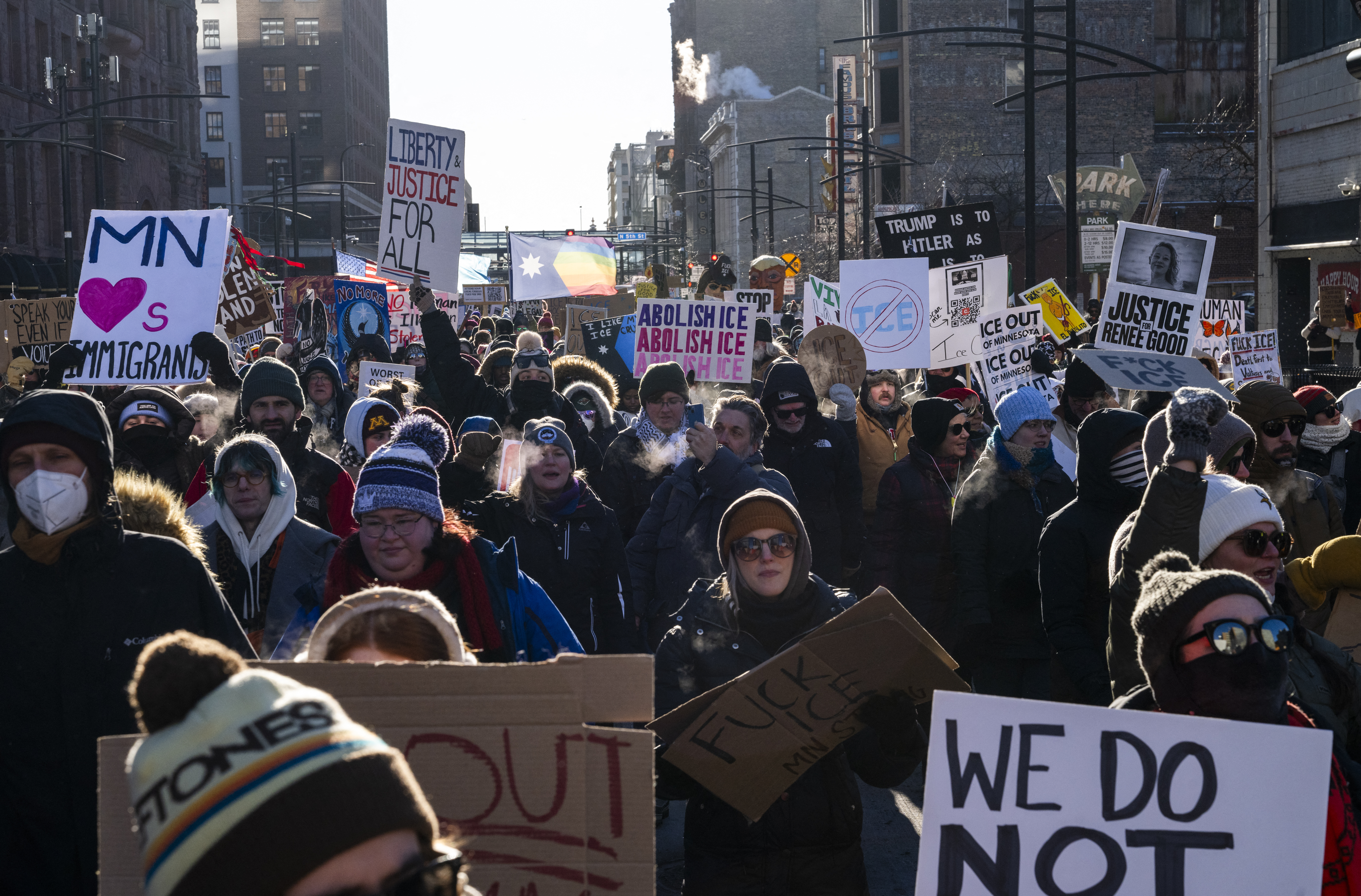Protesters march during a demonstration against ICE enforcement in Minneapolis, Minnesota, US