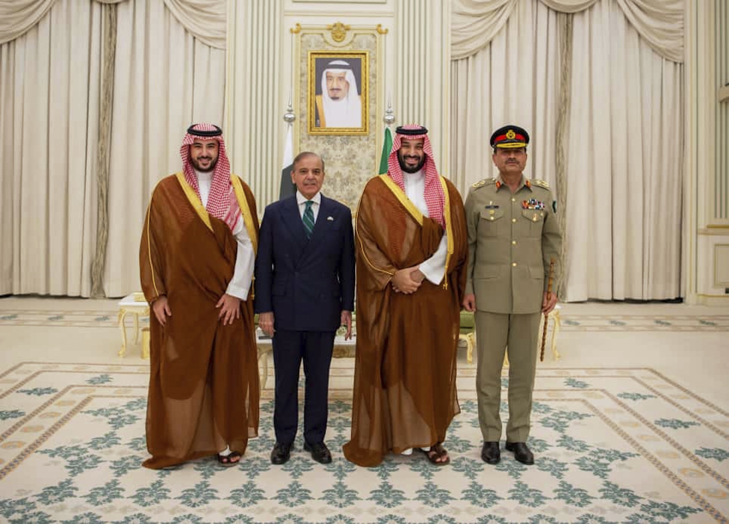 In this photo released by Pakistan's Press Information Department, Saudi Arabia's Crown Prince Mohammed bin Salman, second right, Saudi Arabia's Defence Minister Khalid bin Salman, left, Pakistan's Prime Minister Shehbaz Sharif, second left, and Pakistan's Army Chief Field Marshal Asim Munir, pose for photographs after signing a mutual defense pact, in Riyadh, Saudi Arabia, Wednesday, Sept. 17, 2025. (Press Information Department via AP)