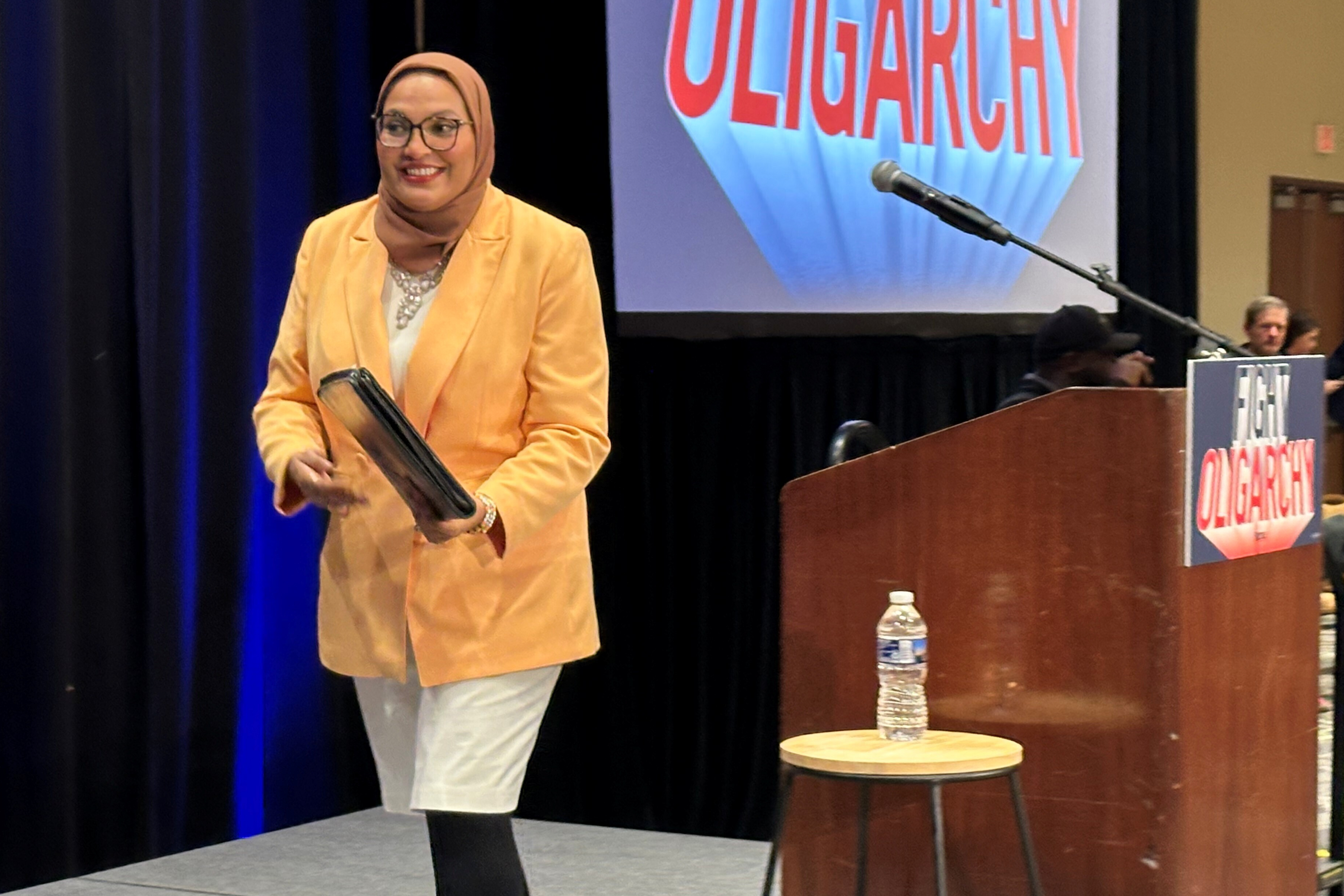 Nida Allam, a Durham County commissioner and North Carolina Democratic congressional primary candidate, walks off the stage at a Bernie Sanders rally in Durham, N.C., Friday, Feb. 13, 2026. (AP Photo/Gary D. Robertson)