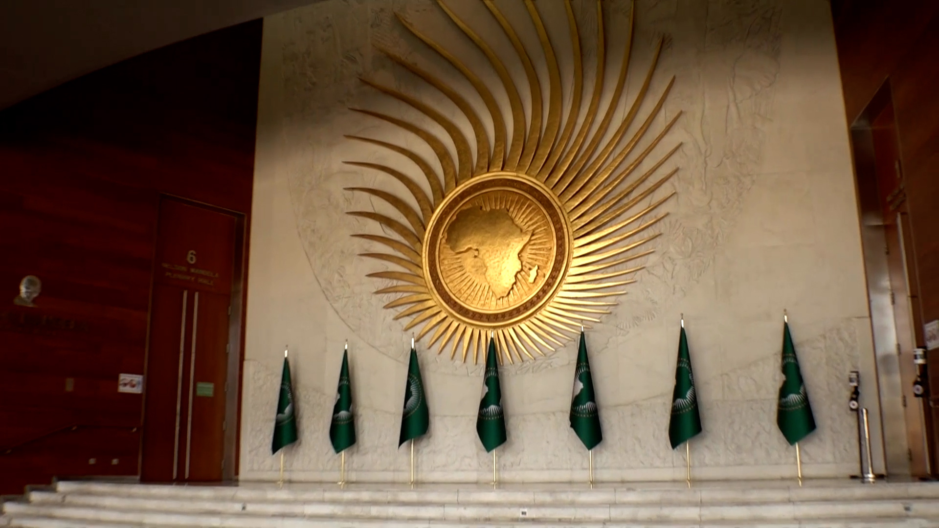 The African Union emblem depicting the African continent framed by sun rays is seen inside the AU headquarters in Addis Ababa, Ethiopia as leaders prepare to meet for an upcoming summit. [Al Jazeera]