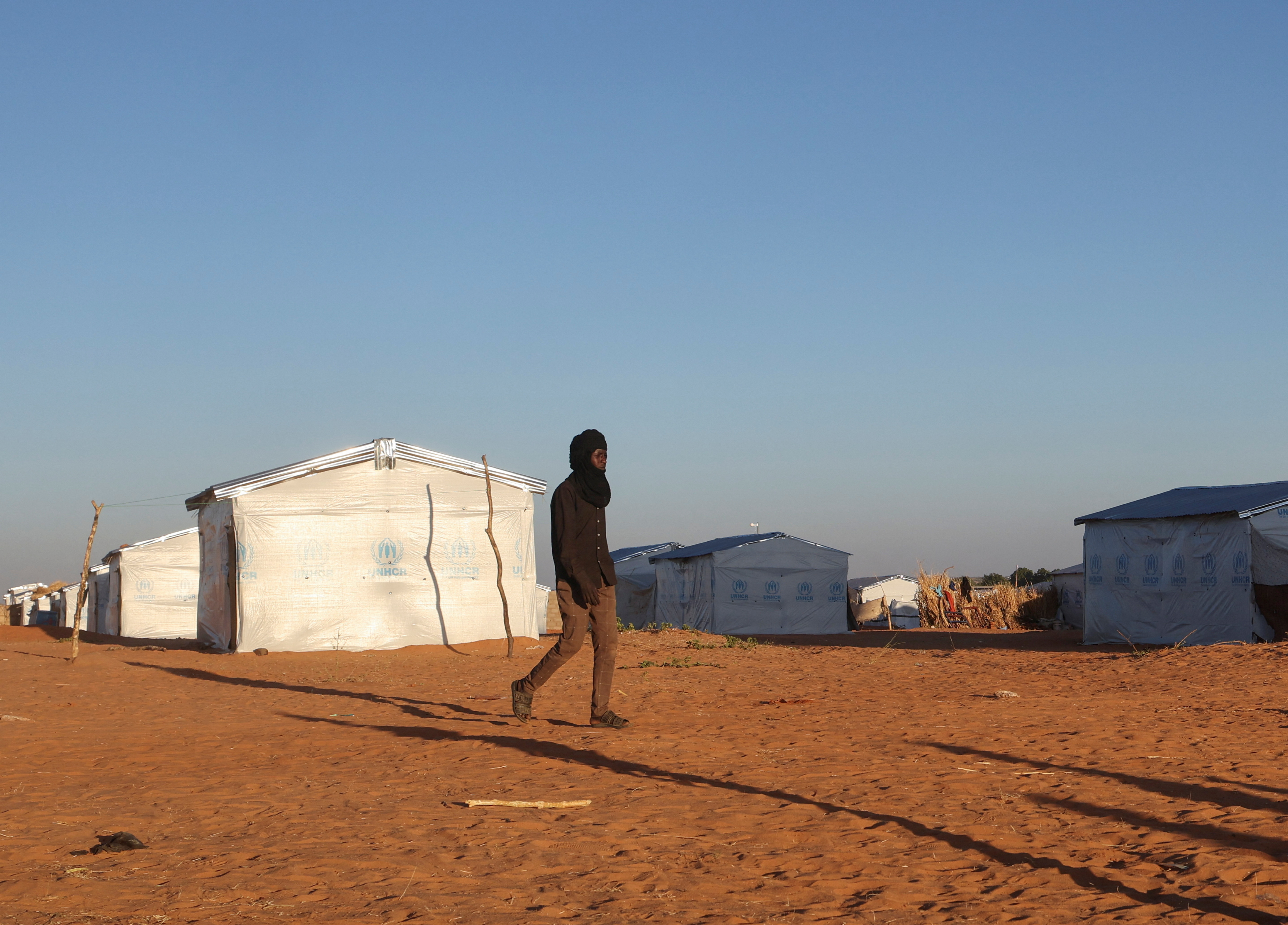 A Sudanese refugee walks at Tulum camp in eastern Chad