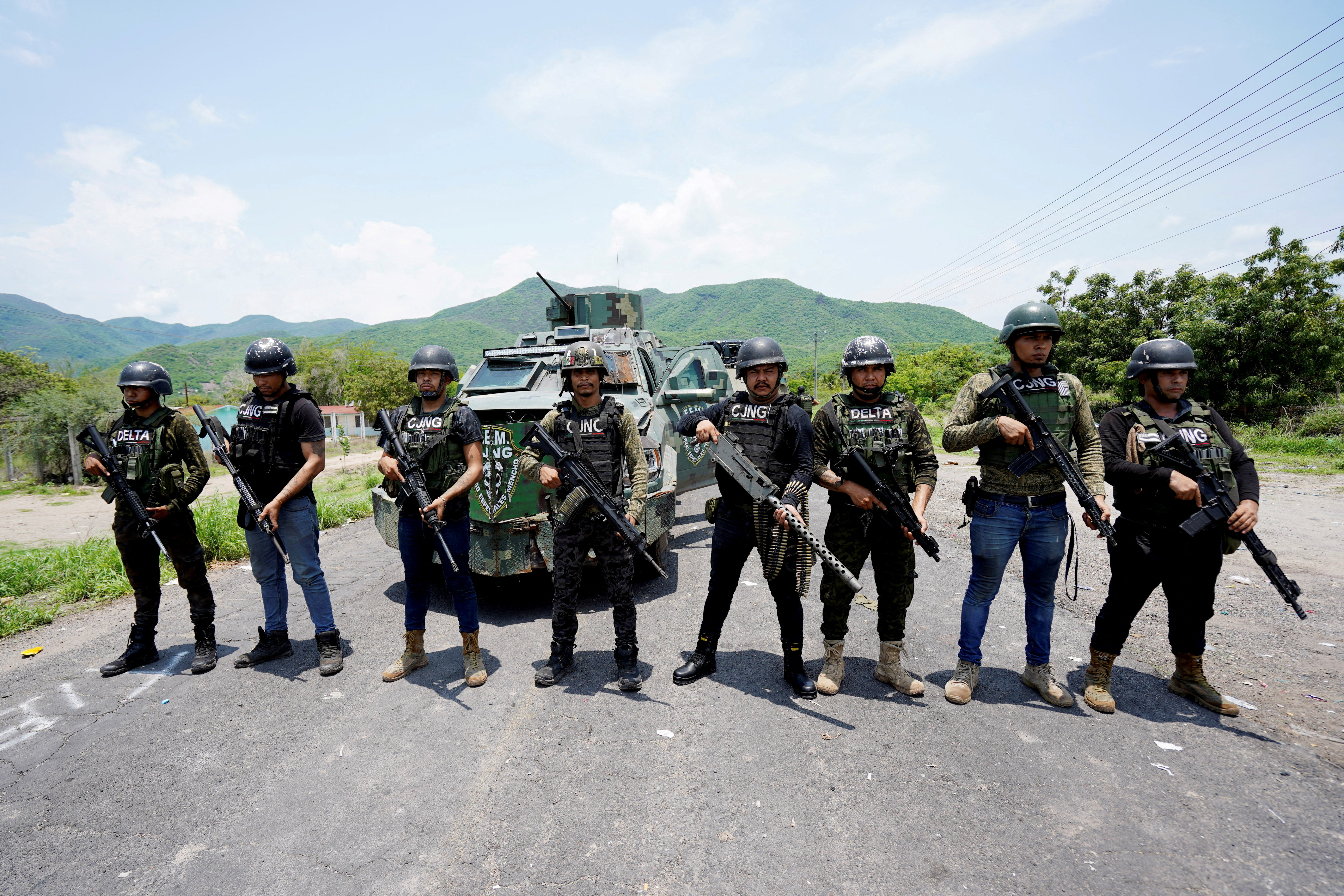 FILE PHOTO: Members of the Jalisco New Generation Cartel (CJNG), led by Nemesio Oseguera, known as “El Mencho,” pose for a photo at an undisclosed location in Michoacan state, Mexico, July 1, 2021. REUTERS/Stringer