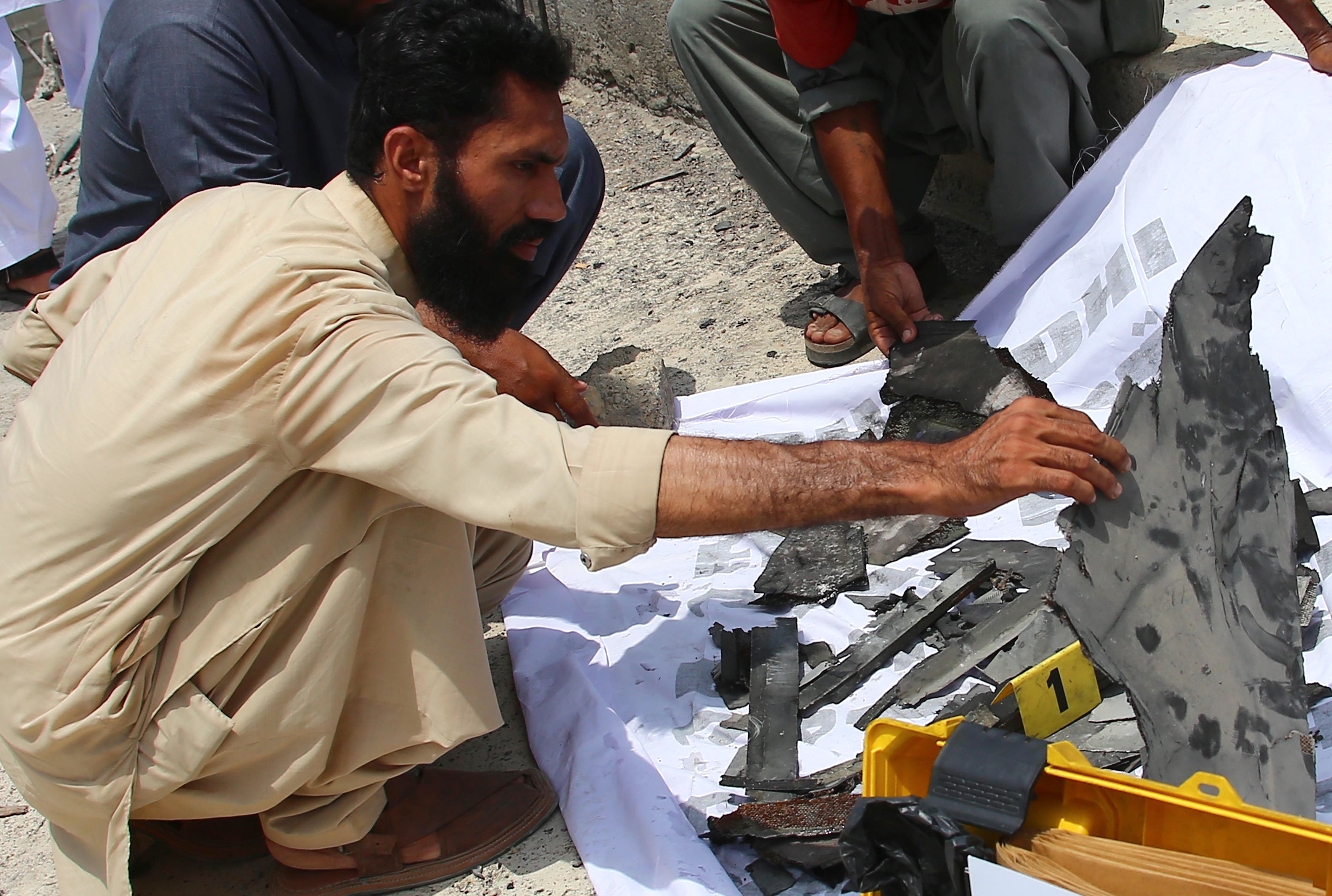 epa12083060 A man inspects debris at the site of an alleged Indian drone strike in Karachi, Pakistan, 08 May 2025. The Pakistani military reported that Indian drone attacks have resulted in the death of at least one civilian and injuries to four soldiers across multiple locations in Pakistan, including Lahore and Karachi, while 12 Indian Harop drones were neutralized, amid intensified India-Pakistan tensions following an attack on a group of tourists in Pahalgam, Indian-administered Kashmir, on 22 April. EPA/REHAN KHAN