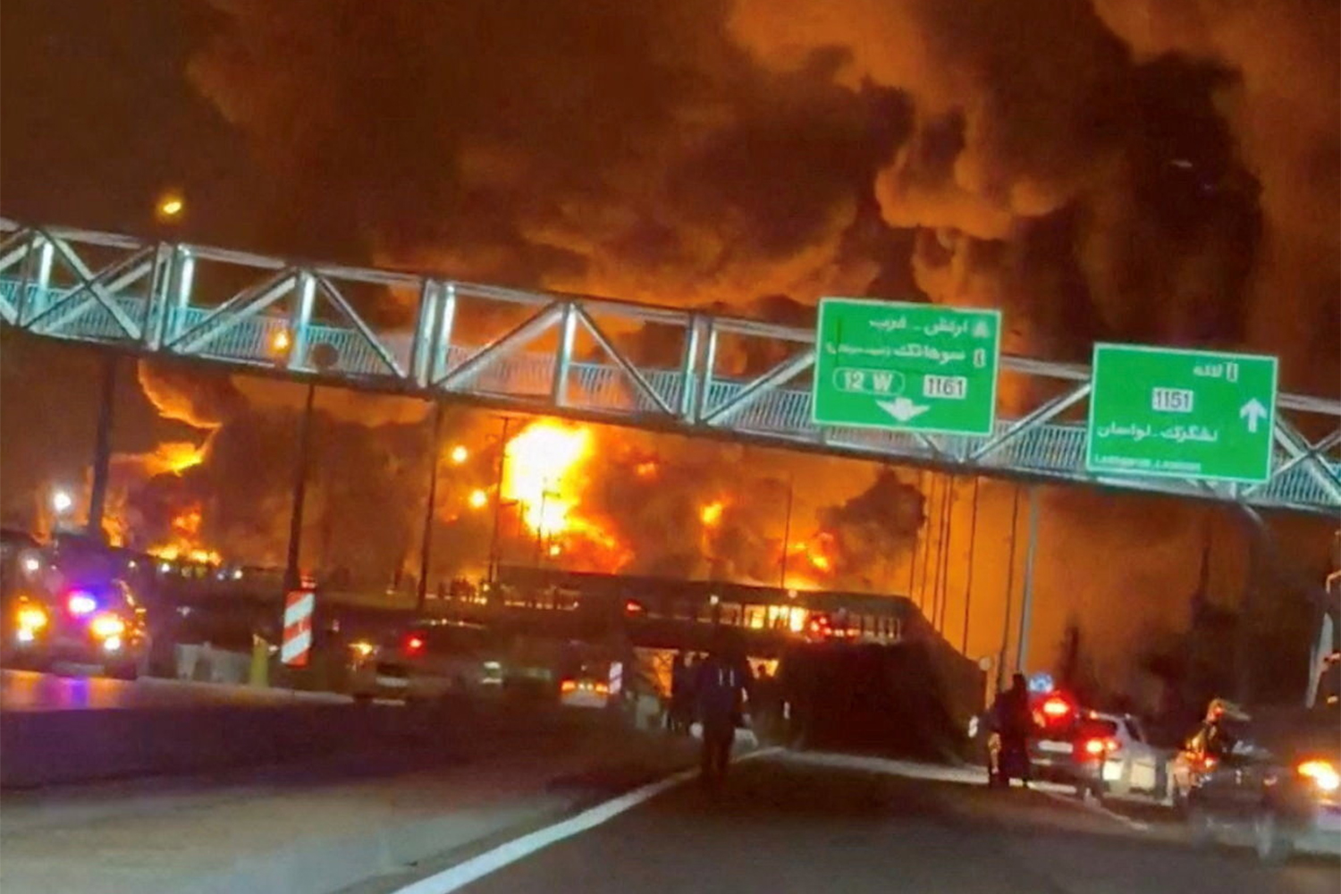 Fire burns and smoke rises from Aqdasieh Oil Depot after being reportedly hit by strike, amid the U.S.-Israeli conflict with Iran, in Tehran, Iran in this screengrab taken from a social media video released on March 8, 2026. SOCIAL MEDIA/via REUTERS THIS IMAGE HAS BEEN SUPPLIED BY A THIRD PARTY. NO RESALES. NO ARCHIVES. VERIFICATION: Reuters confirmed the location as Tehran by the road layout, utility poles and trees which match file and satellite imagery. The date of the video could not be verified, but no older version was found posted online before March 8. Israeli military also wrote on Telegram that it had struck a number of fuel storage facilities in Tehran on March 8. Iran’s state agencies reported attacks on a number of oil depots on March 7. NASA FIRMS detected thermal activity on coordinate 35.790649529257415, 51.539333520742645 at 1:50 a.m. on March 8 (10:20 p.m. UTC March 7). The coordinates were tagged as Petrol Storage Aqdasieh on the online map.