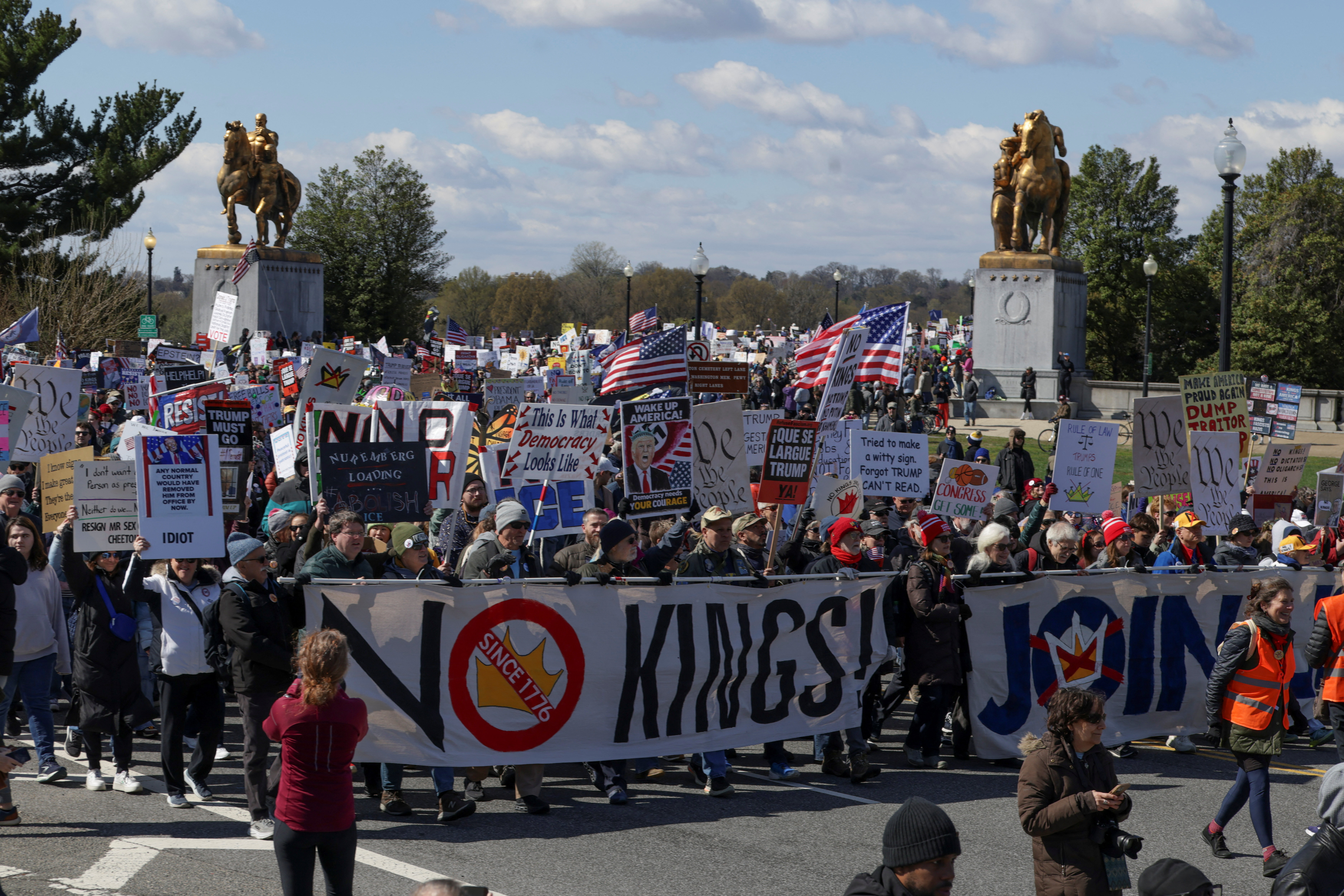 Marchers in Washington DC hold a 'no kings' sign