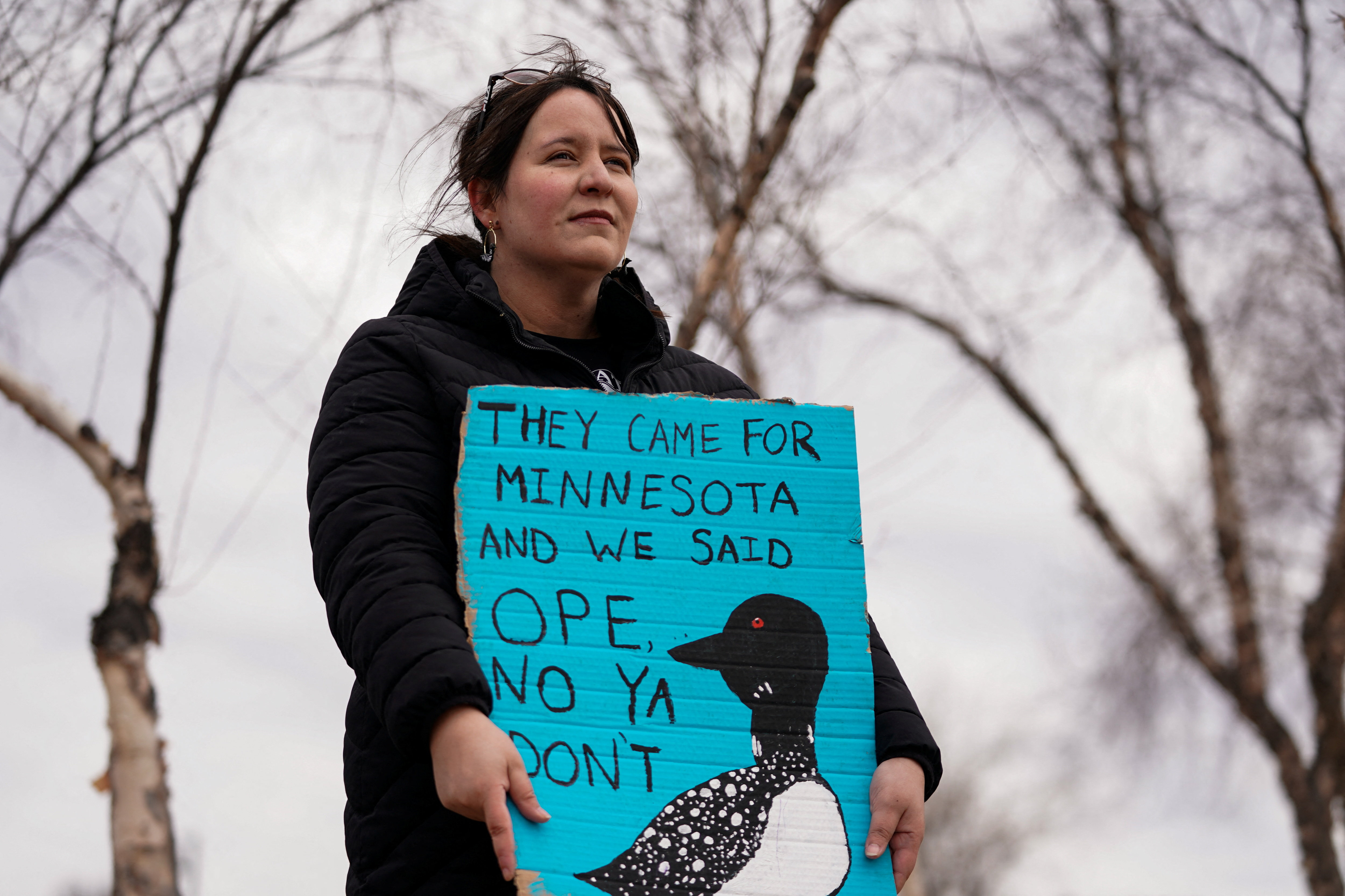 A protester holds a sign at an anti-Trump rally
