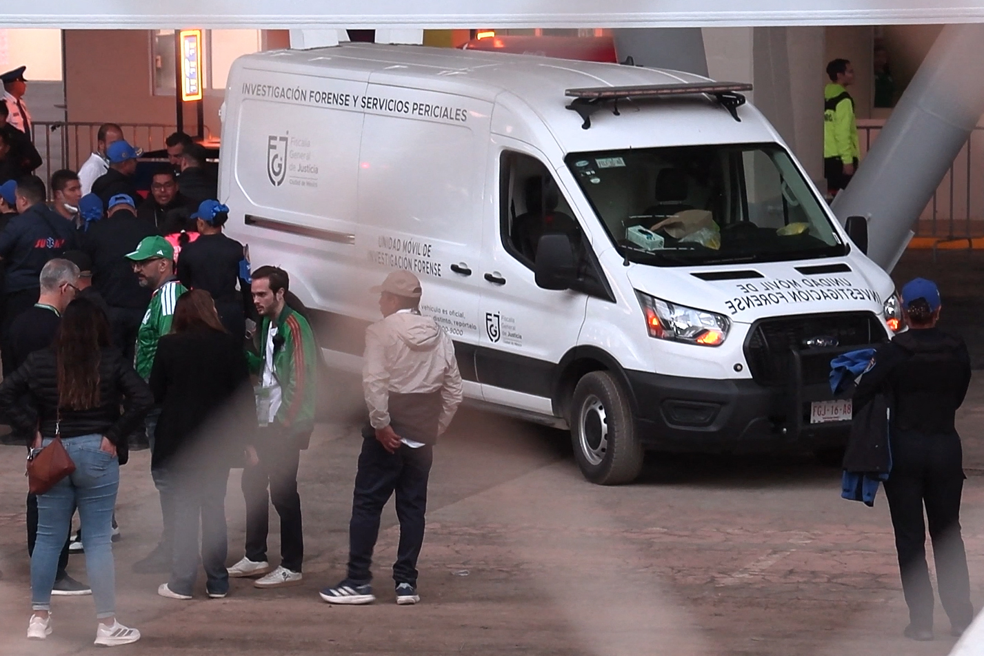 This frame grab from AFPTV footage shows a forensic investigation van where a spectator died after falling from an upper level of the stadium before the friendly football match between Mexico and Portugal at the Banorte (formerly known as Azteca) Stadium in Mexico City on March 28, 2026. In the VIP section of the Estadio Ciudad de Mexico (Azteca), an intoxicated fan attempted to jump from the second level to the first by climbing over the outer railing, causing him to fall to the ground floor. He was treated by medical personnel but, unfortunately, died, the Secretariat of Civil Security reported in a statement. (Photo by Ivan CASTANEIRA / AFPTV / AFP)
