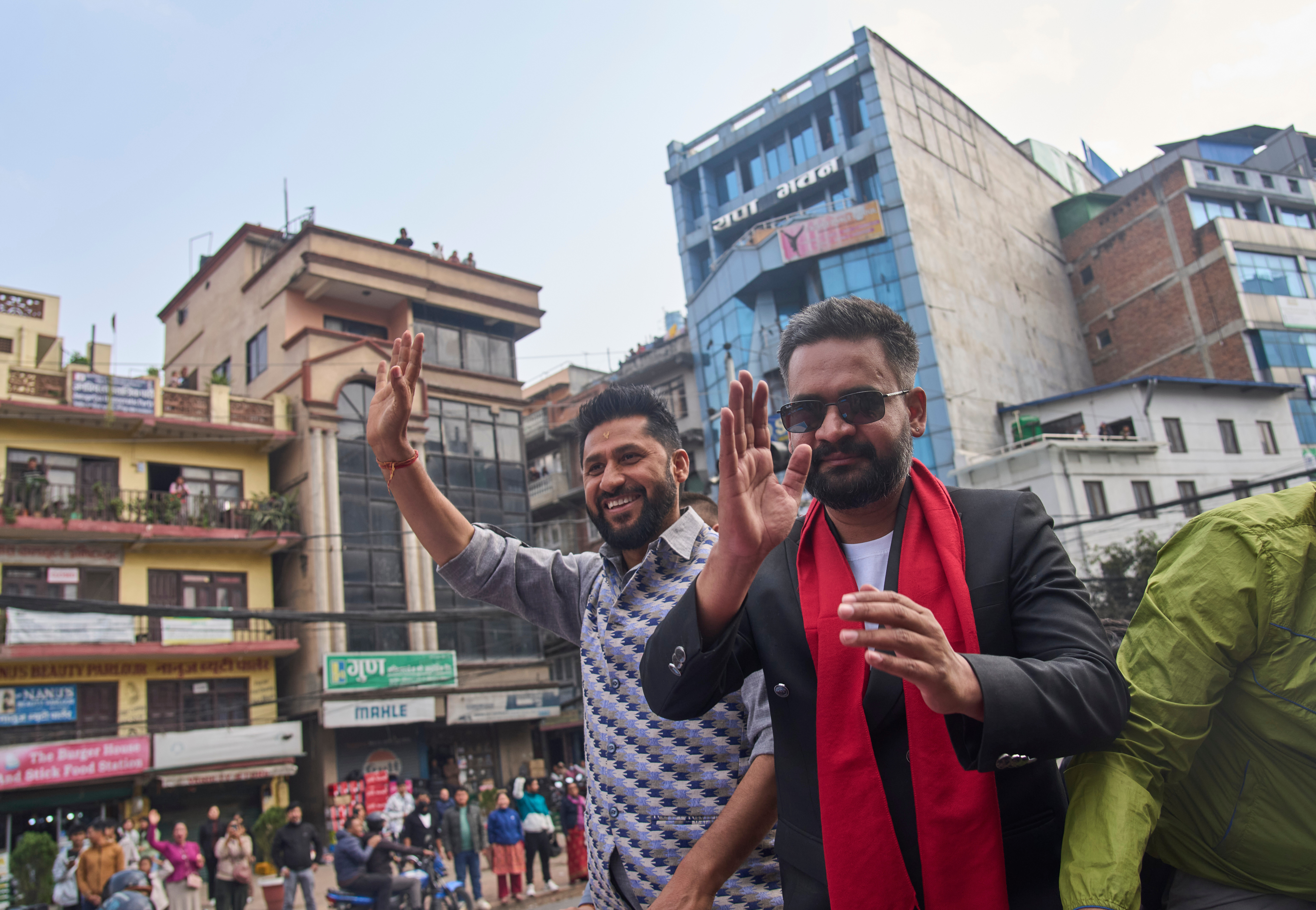 Balendra Shah, right, former mayor of Kathmandu Metropolitan City and prime ministerial candidate of the Rastriya Swatantra Party, joins Rabi Lamichhane, left, the party's president, during an election campaign rally in Lalitpur, Nepal, Saturday, Feb. 28, 2026. (AP Photo/Niranjan Shrestha)
