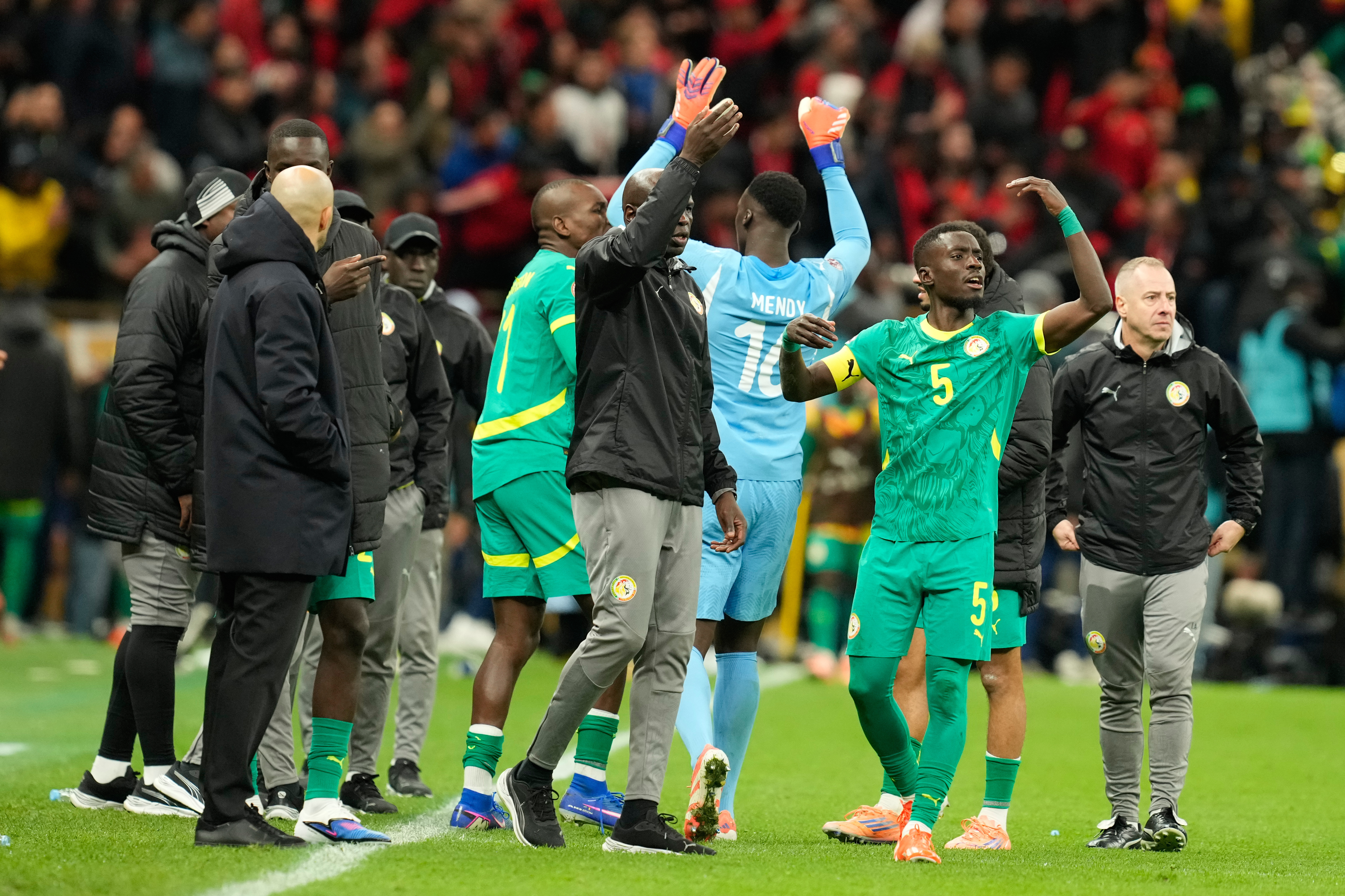 Senegal's Idrissa Gueye calls players to walk off the ptich during the Africa Cup of Nations final football match between Senegal and Morocco