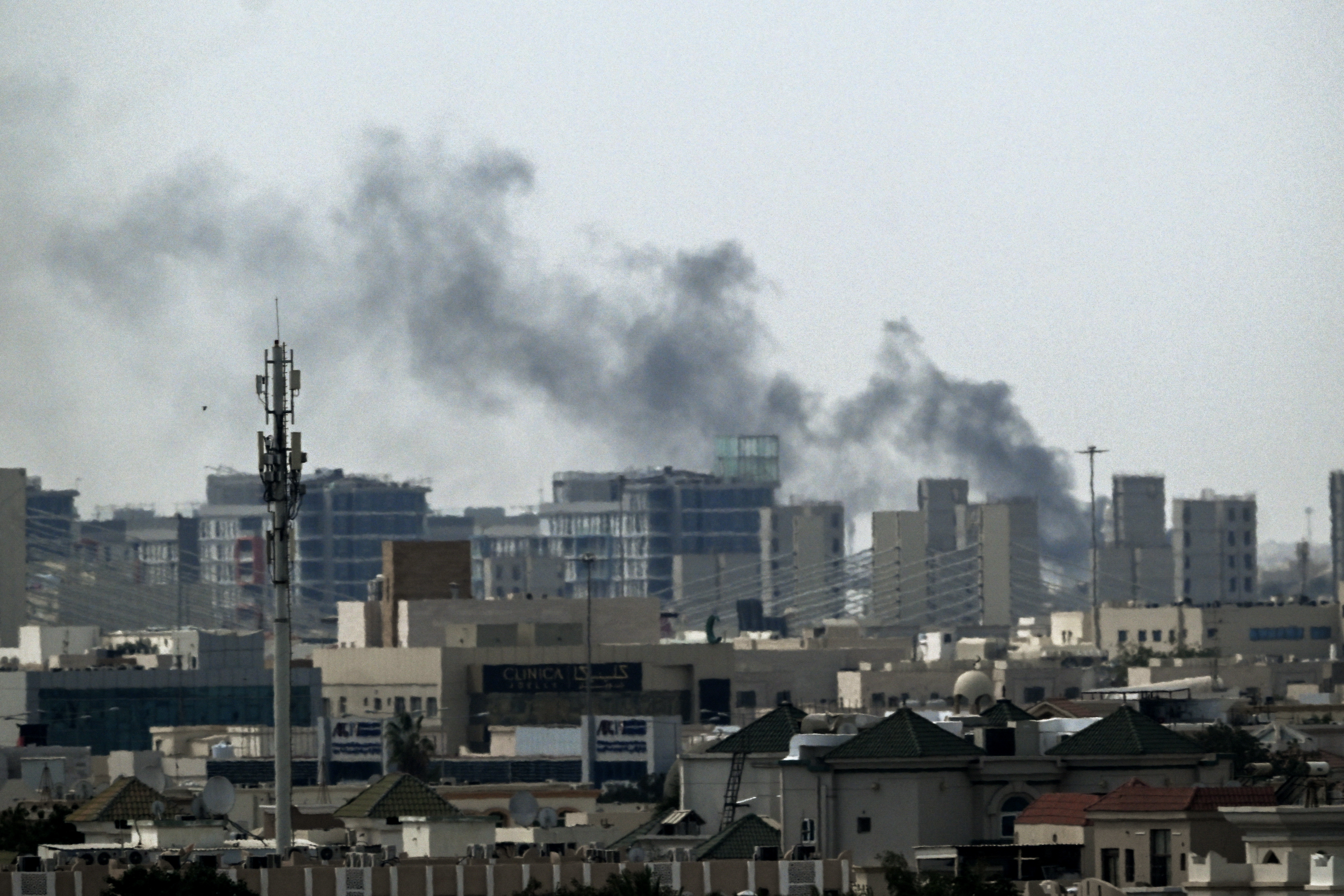 A plume of smoke rises over buildings in Doha on March 5, 2026.