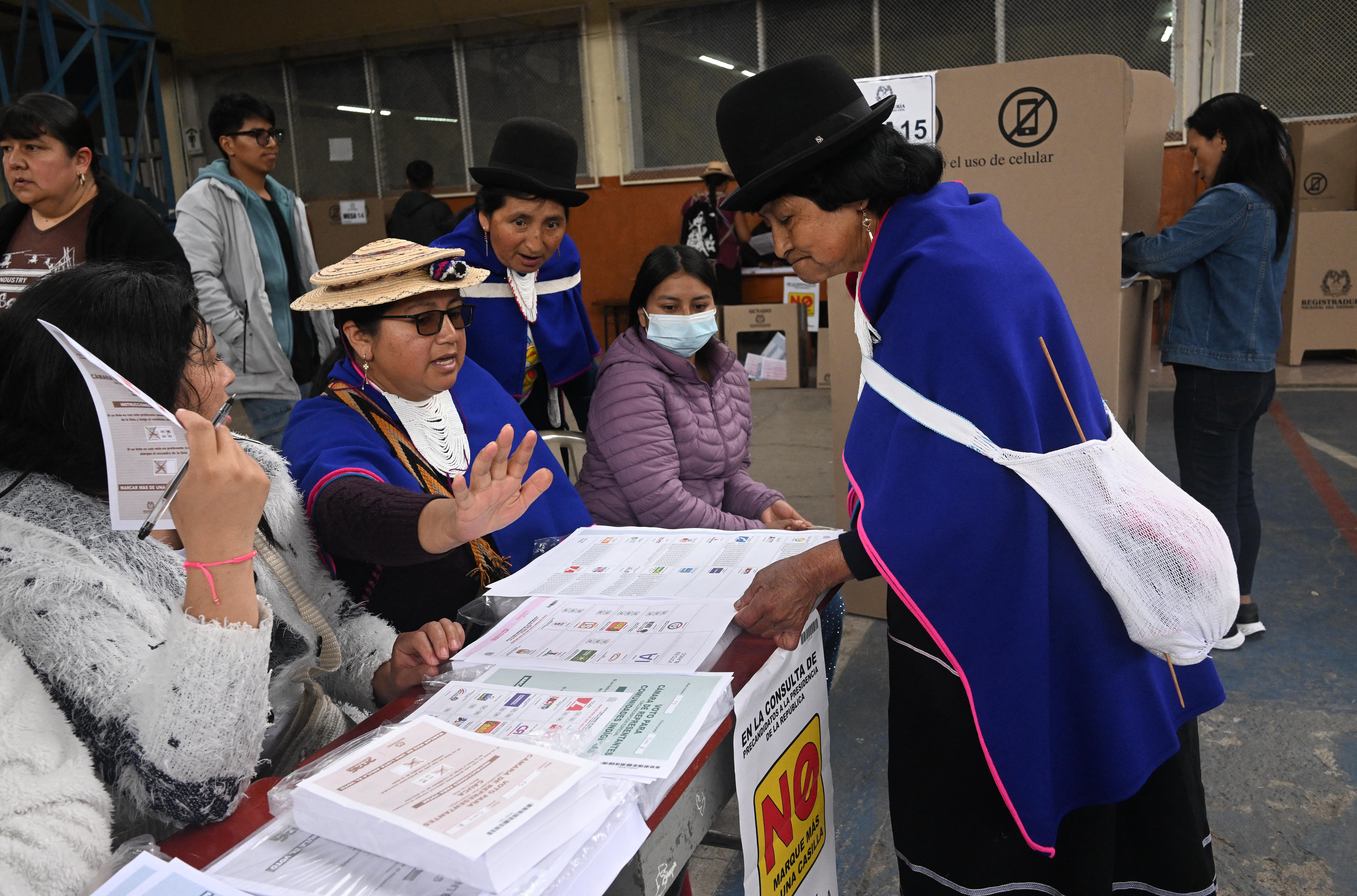 An Indigenous Misak woman waits for her ballot to vote at a polling station during legislative elections in Silvia, Cauca department, Colombia, on March 8, 2026.