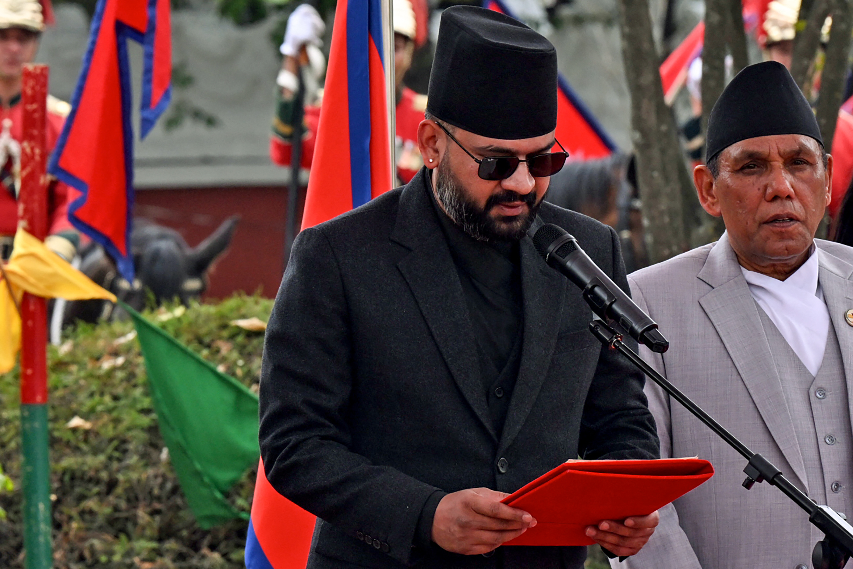 Rastriya Swatantra Party (RSP) leader Balendra Shah (2nd R) takes oath as prime minister during a swearing-in ceremony.
