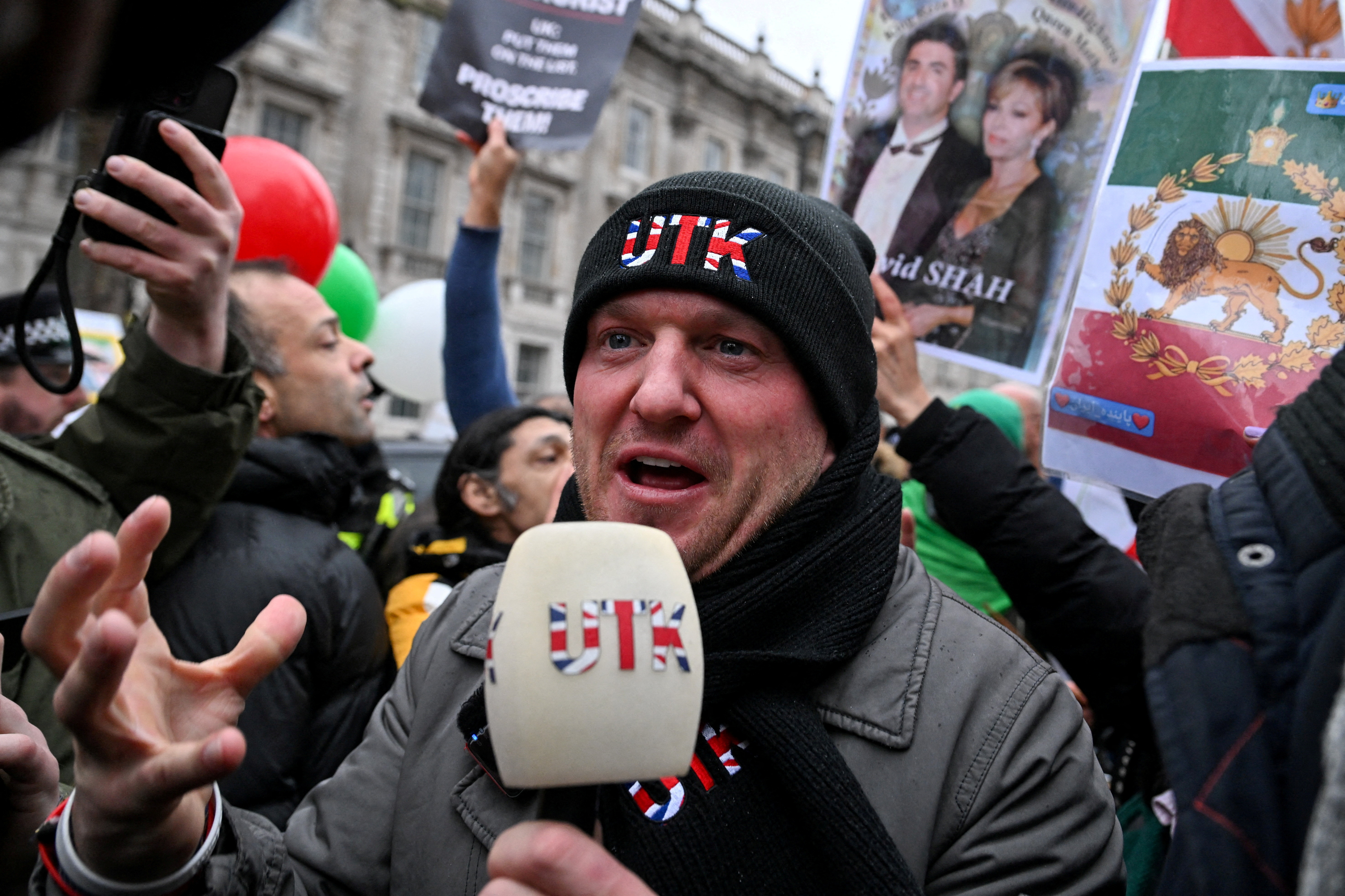 FILE PHOTO: Activist Stephen Yaxley-Lennon, known as Tommy Robinson, attends a protest in support of the Iranian people outside Downing Street, as protests have spread across Iran since the end of December in response to soaring inflation and protesters demanding an end to clerical rule, in London, Britain, January 11, 2026. REUTERS/Chris J Ratcliffe/File Photo