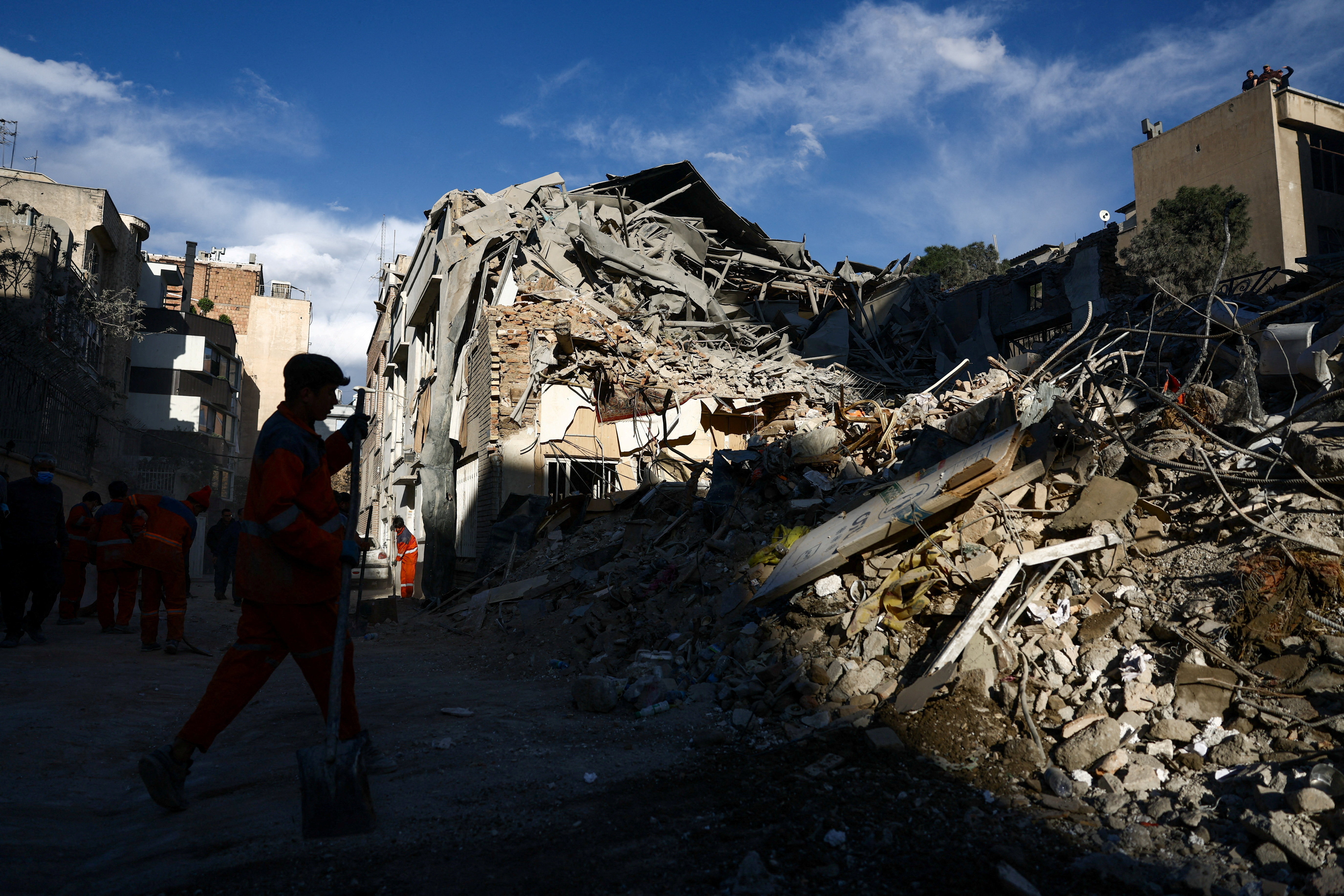 A man clears rubble of a Synagogue, which was damaged in a strike, from a street, amid the U.S.-Israeli conflict with Iran, in Tehran, Iran, April 7, 2026. Majid Asgaripour/WANA (West Asia News Agency) via REUTERS ATTENTION EDITORS - THIS PICTURE WAS PROVIDED BY A THIRD PARTY