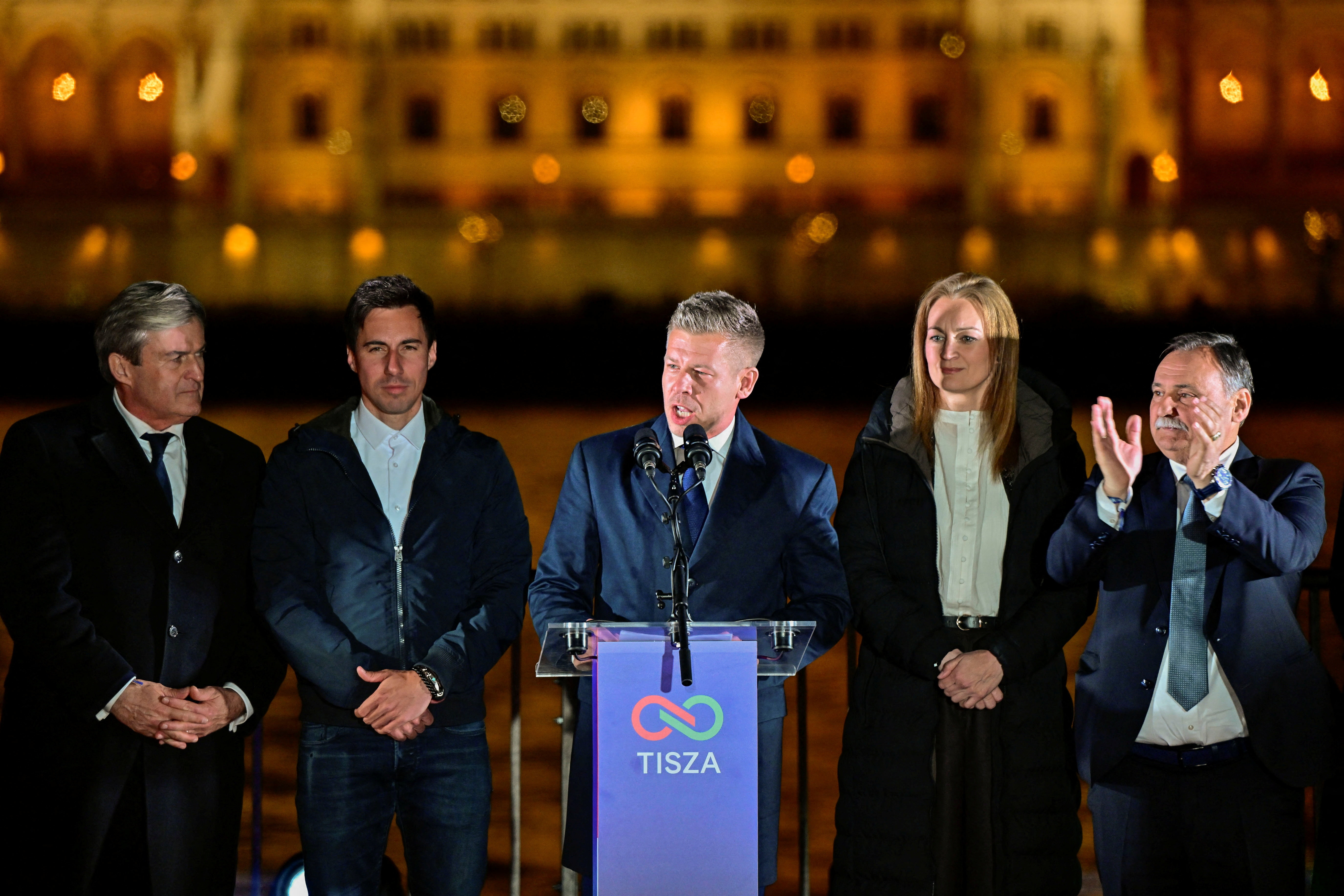 Peter Magyar, leader of the opposition Tisza party, speaks as he and other officials celebrate following the partial results of the parliamentary election, in Budapest, Hungary