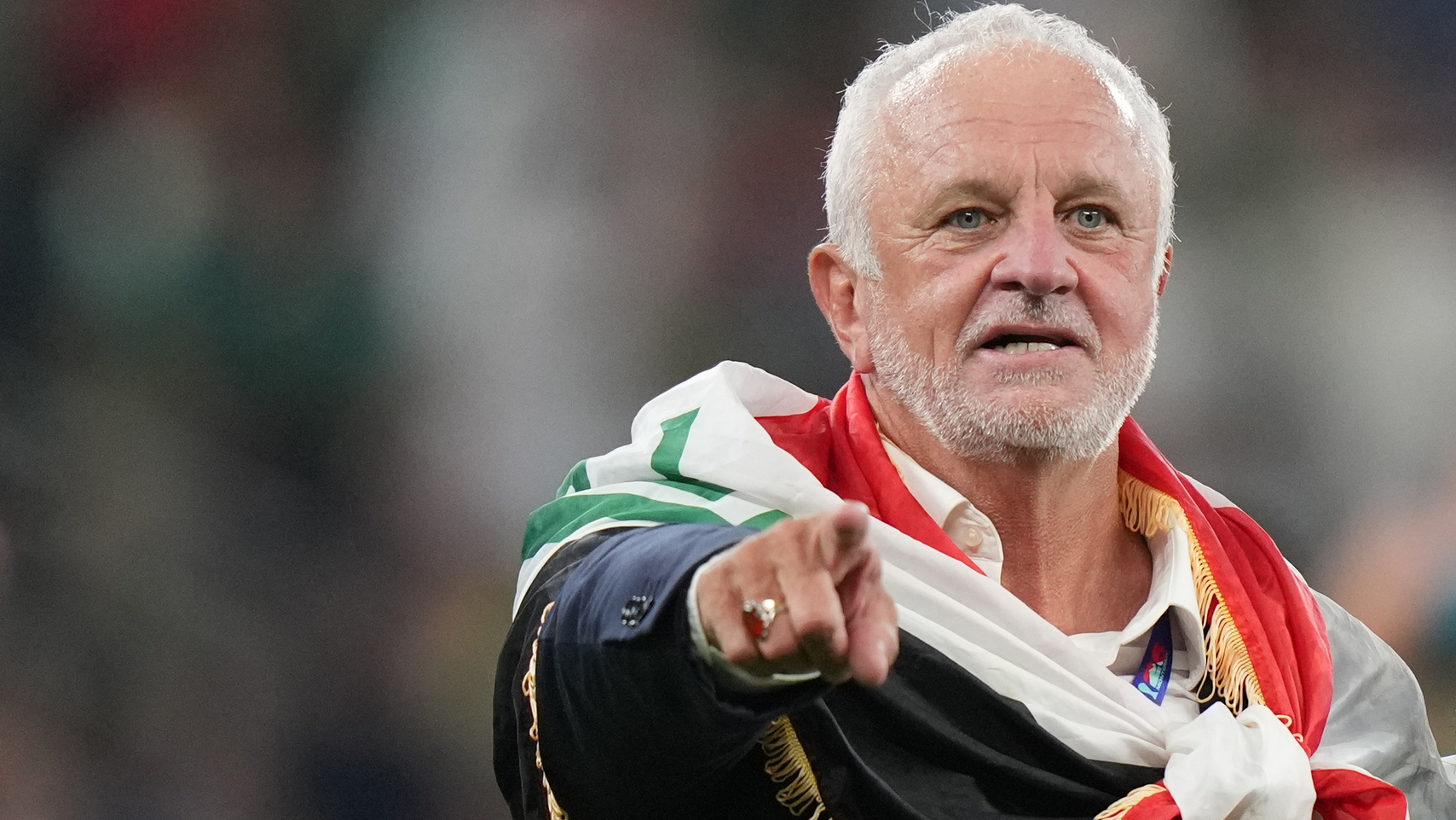 Iraq's coach Graham Arnold, left, celebrates as Bolivia's goalkeeper Carlos Lampe, right, comforts Luis Haquin after the World Cup playoff final soccer match between Iraq and Bolivia in Monterrey, Mexico, Tuesday, March 31, 2026. (AP Photo/Fernando Llano)